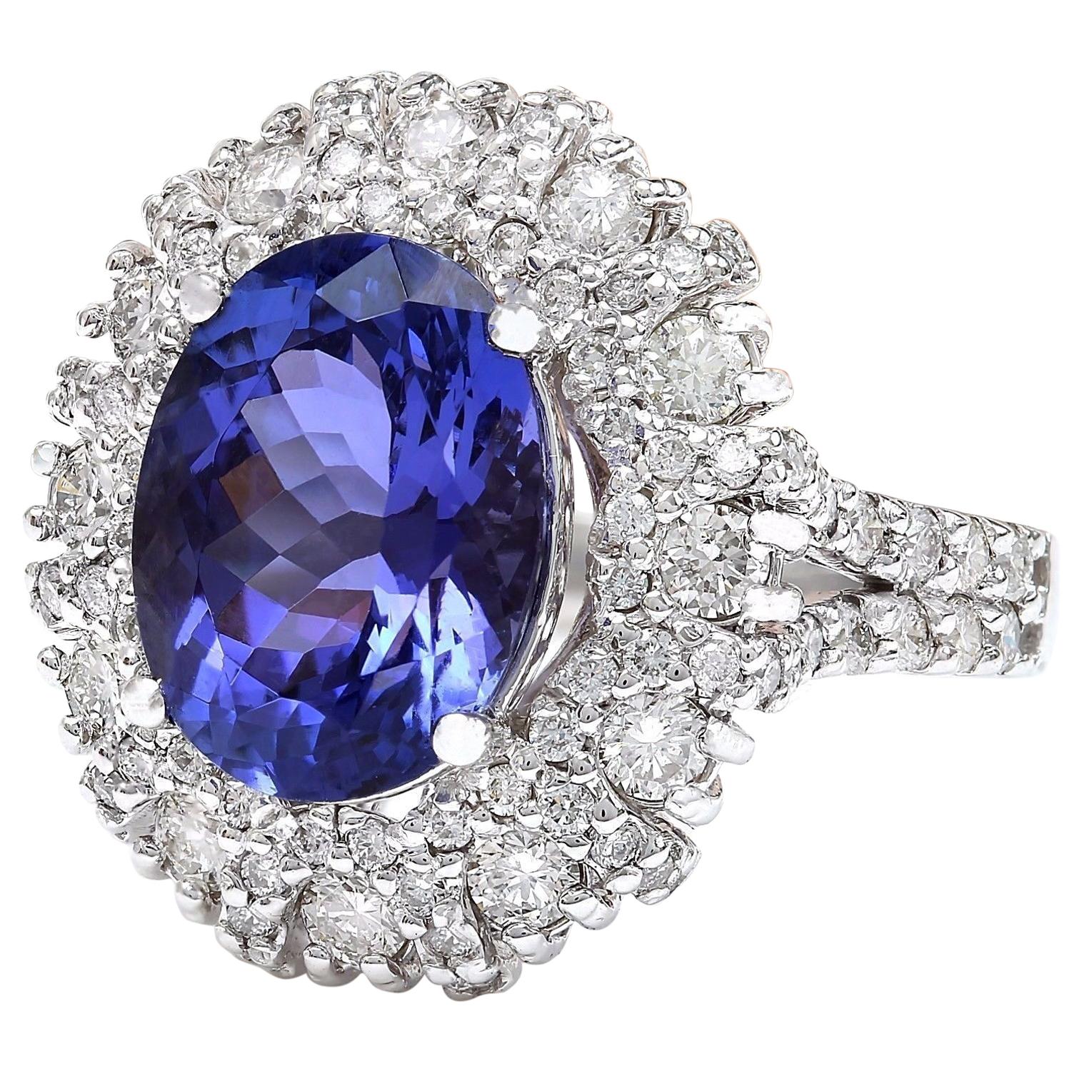 Presenting our exquisite 7.14 Carat Tanzanite 14K Solid White Gold Diamond Ring. Crafted from genuine 14K White Gold, this ring boasts a total metal weight of 5.6 grams, ensuring both quality and durability. At its center shines a stunning