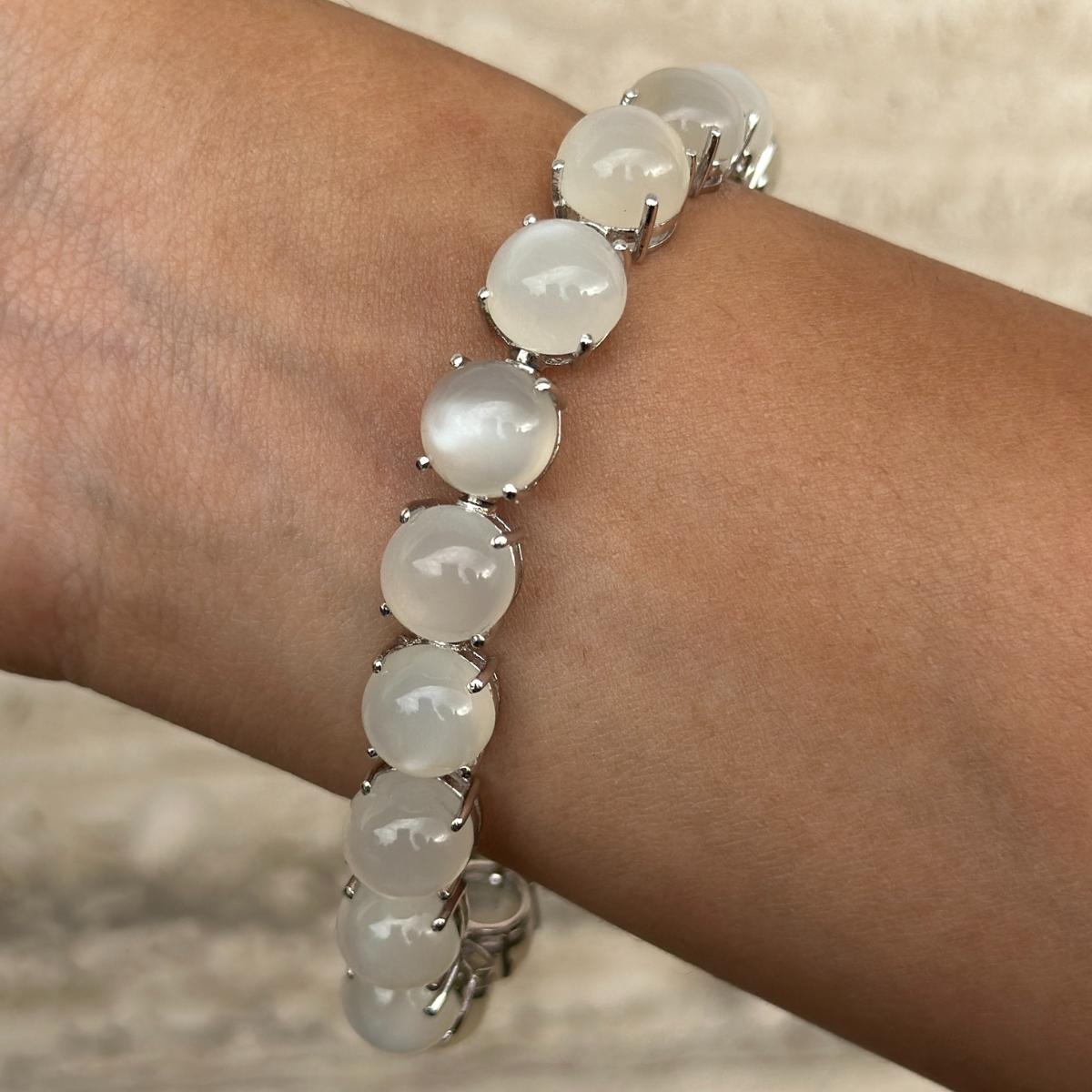 71.45 Carat Round Cabochon Cut Moonstone Tennis Bracelet in sterling silver showcases endlessly sparkling natural moonstone, weighing 71.45 carat. It measures 7 inches long in length. 
Moonstone stimulate concentration and reduces stress. 
Designed