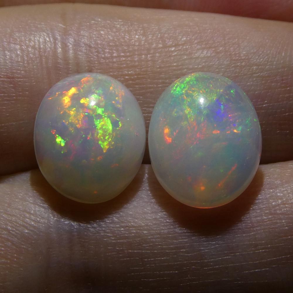 Description:

 

Gem Type: Opal
Number of Stones: 2
Weight: 7.14 cts
Measurements: 12.10x10.11x6.28 mm & 11.69x9.90x5.93 mm
Shape: Oval Cabochon
Cutting Style Crown: Cabochon
Cutting Style Pavilion:
Transparency: Translucent
Clarity: