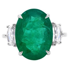 7.14ct Oval Emerald 0.81ct Cadillac Cut Diamond Three Stone Ring 18K White Gold