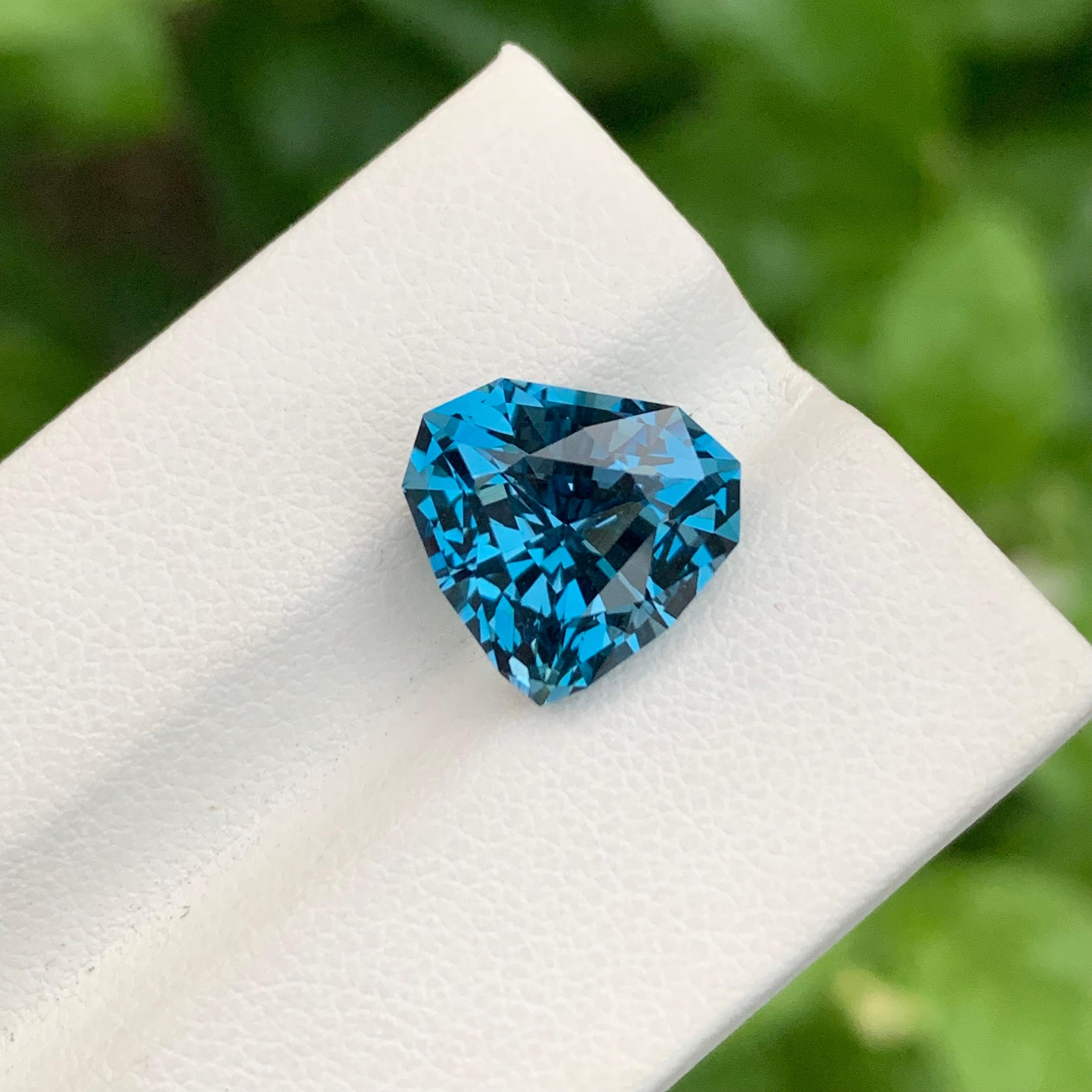 Loose London Blue Topaz 

Weight: 7.15 Carats
Dimension: 11.6 x 11.8 x 7.8 Mm 
Origin: Brazil
Shape: Trillion
Color: Deep Blue
Certificate: On Customer Demand

London Blue Topaz is a mesmerizing variety of topaz renowned for its deep and enchanting