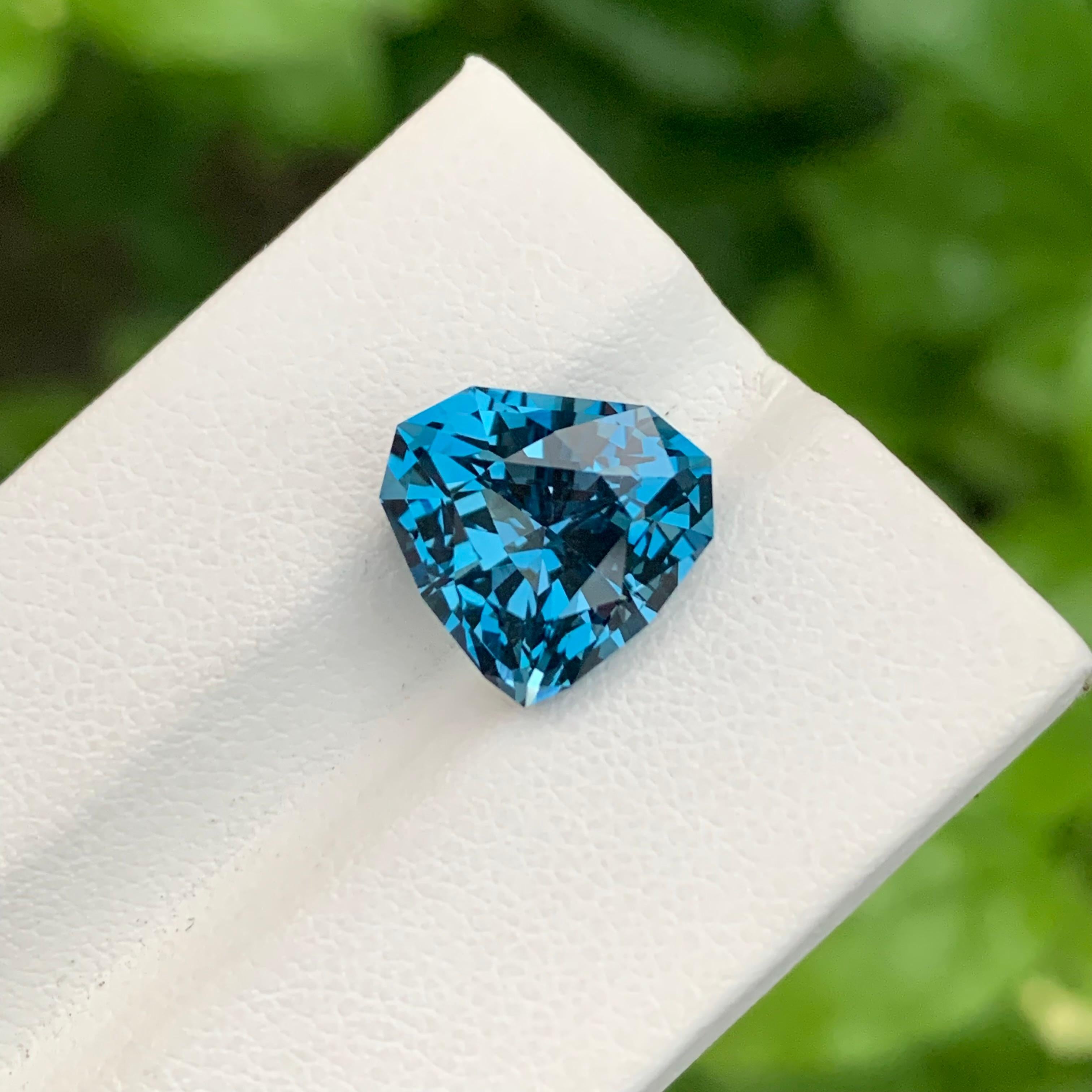 Arts and Crafts 7.15 Carat Gorgeous Faceted London Blue Topaz Trillion Shape Gem For Jewellery For Sale