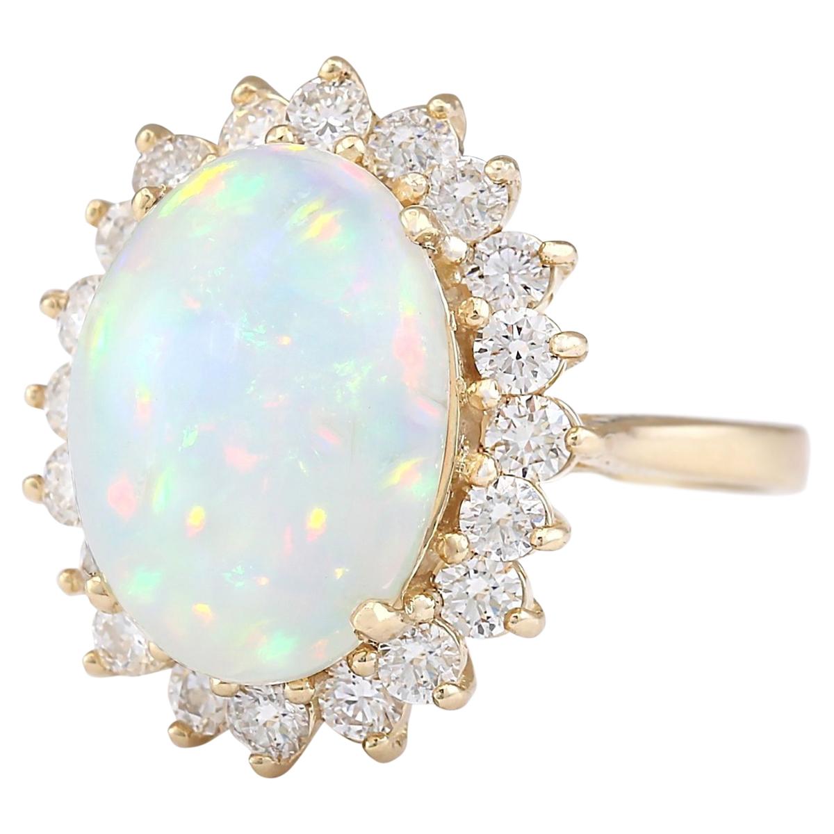 7.15 Carat Natural Opal 14 Karat Yellow Gold Diamond Ring
Stamped: 14K Yellow Gold
Total Ring Weight: 5.9 Grams
Opal Weight is 5.70 Carat (Measures: 15.00x10.00 mm)
Diamond Weight is 1.45 Carat
Color: F-G, Clarity: VS2-SI1
Face Measures: 20.35x17.00