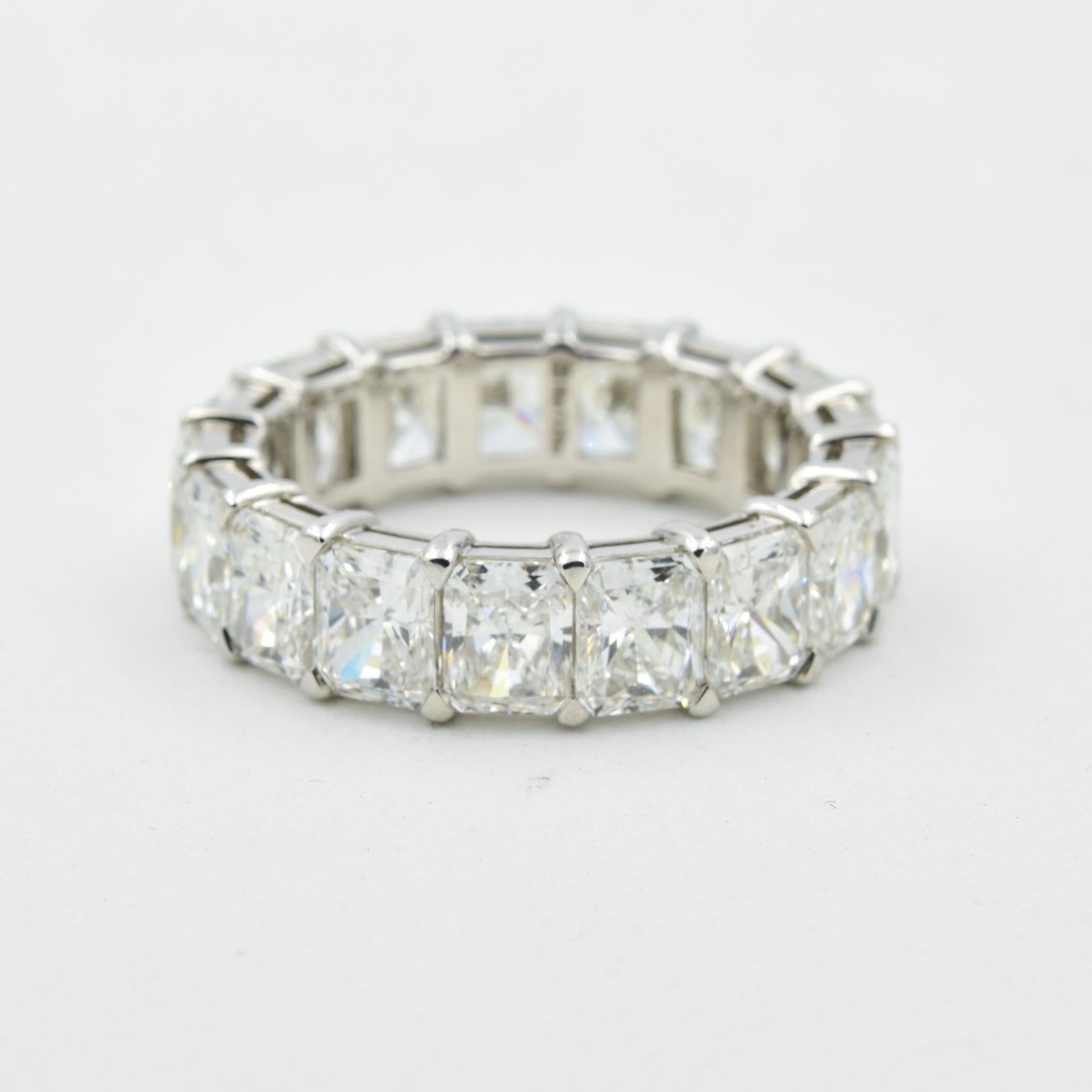 This stunning diamond eternity band in platinum has 7.15 carats of radiant cut diamonds. This ring is made by Norman Silverman, who is known strongly in the jewelry world to represent craftsmanship and quality.  This ring has 17 diamonds each with