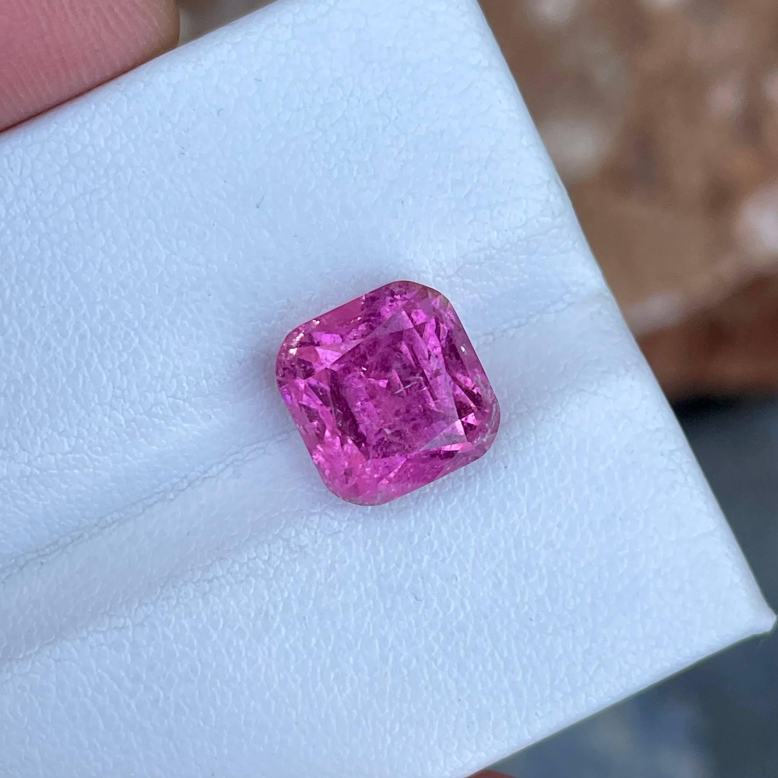 Weight 7.15 carats 
Dimensions 10.2x10.0x8.9 mm
Treatment none 
Origin Afghanistan 
Clarity included 
Shape cushion 
Cut fancy cushion 




The 7.15 carats Sweet Pink Tourmaline Stone showcases a mesmerizing Cushion Cut, emanating from the rich