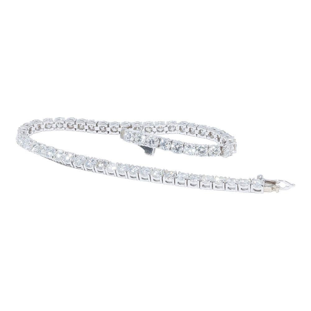 14k white gold bracelet containing 7.16 carats of prong set diamonds. The color and clarity grades of the diamonds contained within the bracelet are E-F, VS1-SI1, respectively. The average polish, symmetry, and cut grade for each of these diamonds