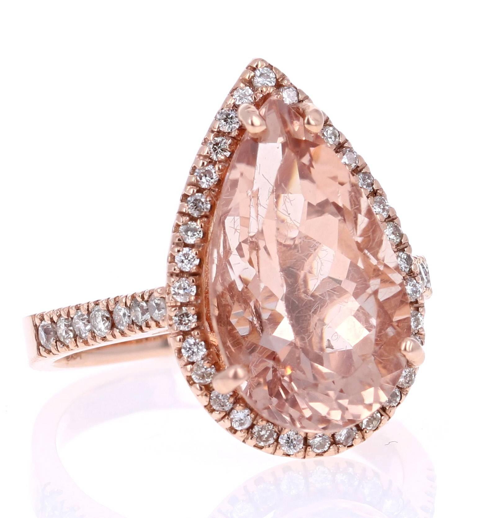 This gorgeous and classy Morganite Ring can easily substitute for a unique and edgy Engagement or Promise ring for that special someone.  

It has a 6.68 Carat Pear Cut Morganite as its center and is surrounded by a halo of 46 Round Cut Diamonds