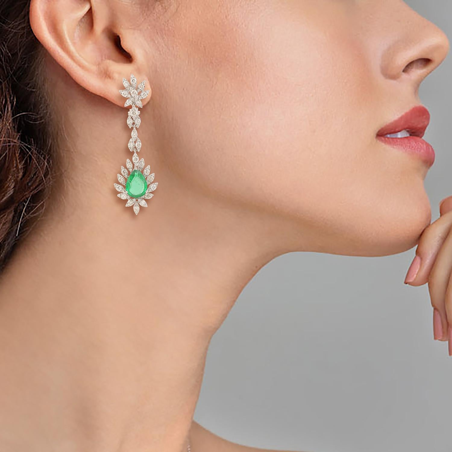 Cast in 14 karat gold, these exquisite earrings are hand set with 7.16 carats emerald and 3.93 carats of glimmering diamonds. 

FOLLOW MEGHNA JEWELS storefront to view the latest collection & exclusive pieces. Meghna Jewels is proudly rated as a Top