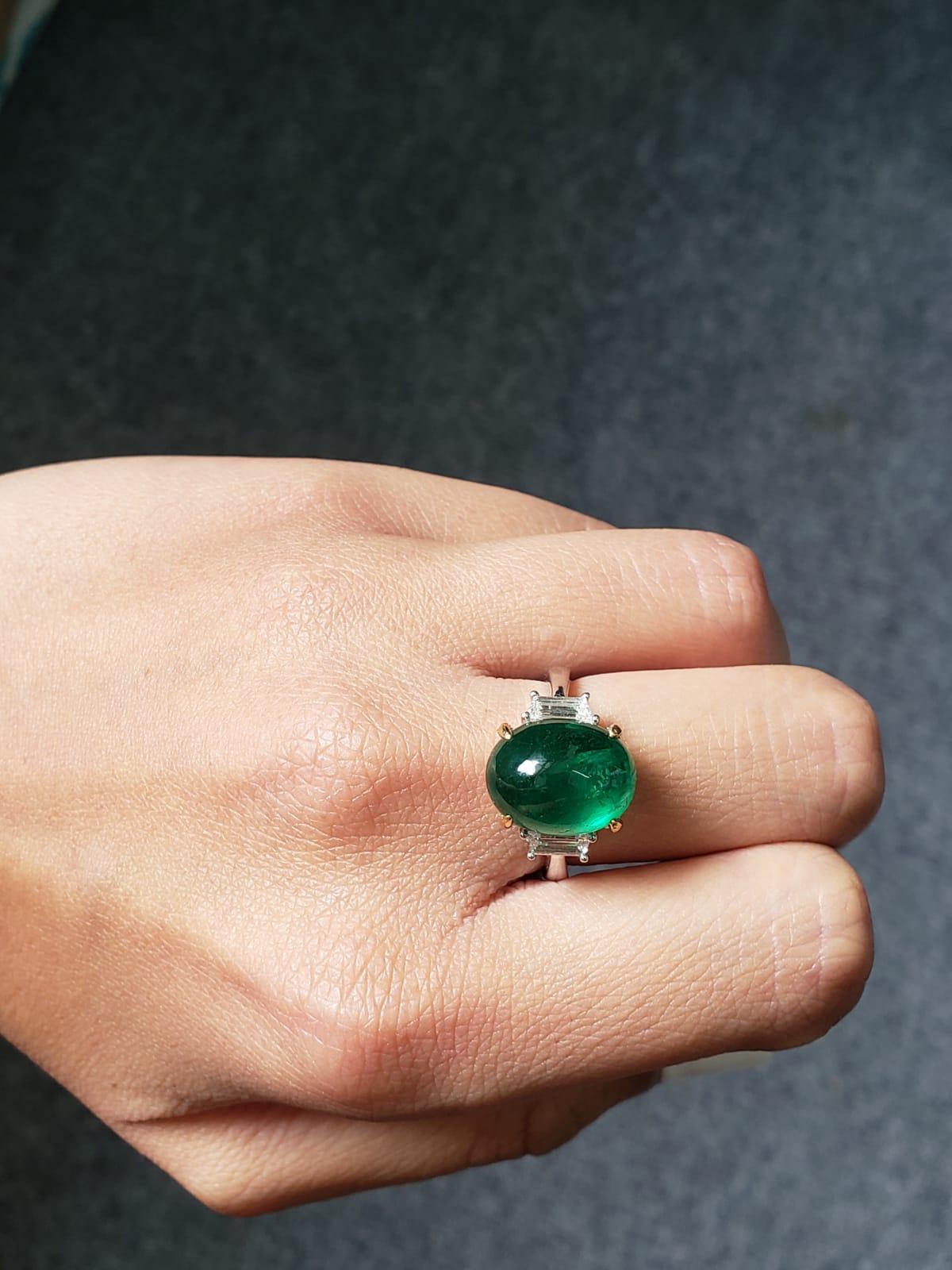 Art Deco 7.17 Carat Emerald Cabochon and Diamond Three-Stone Ring