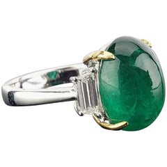 7.17 Carat Emerald Cabochon and Diamond Three-Stone Ring
