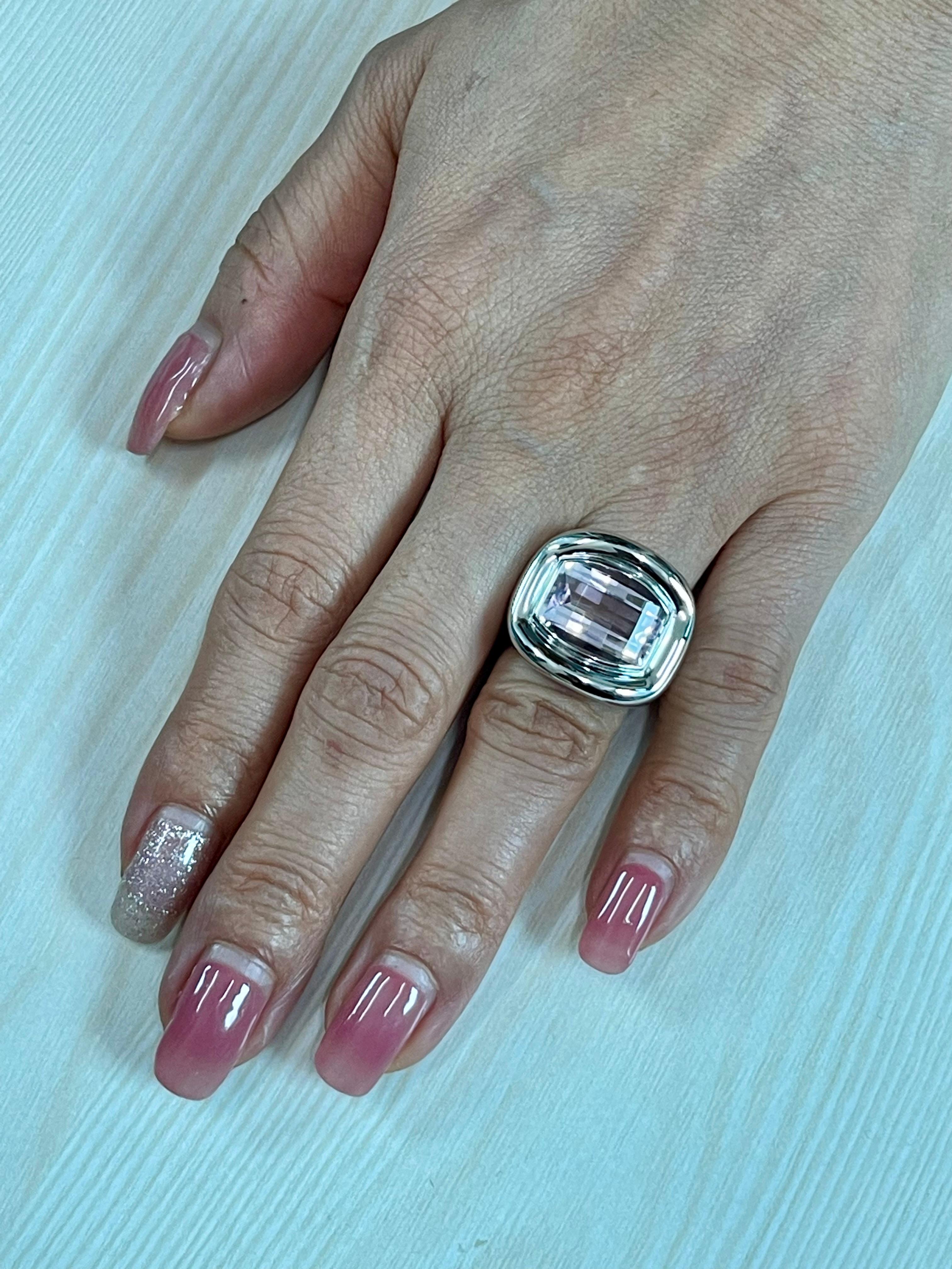 Please check out the HD video. New Old Stock. This is a unisex ring. The kunzite is a very nice light baby pink! This Kuzite statement ring will get you tons of compliments. The center stone is about 7.17cts. The ring is set in solid 18k white gold.