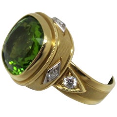 7.18 Carat Peridot with .05 Carat Diamonds 18 Karat Yellow Gold Ring