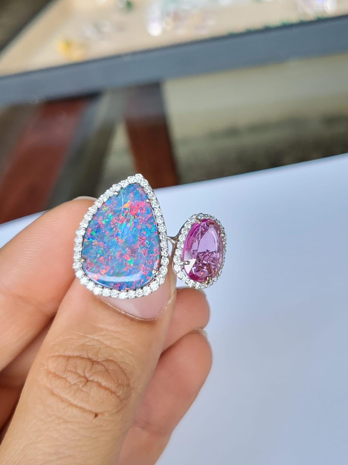 A very gorgeous and beautiful, Doublet Opal & Pink Sapphire Cocktail Ring set in 18K White Gold & Diamonds. The weight of the Doublet Opal is 7.19 carats. The Doublet Opal is of Australian origin. The Opal has a red, green and blue play of colour.