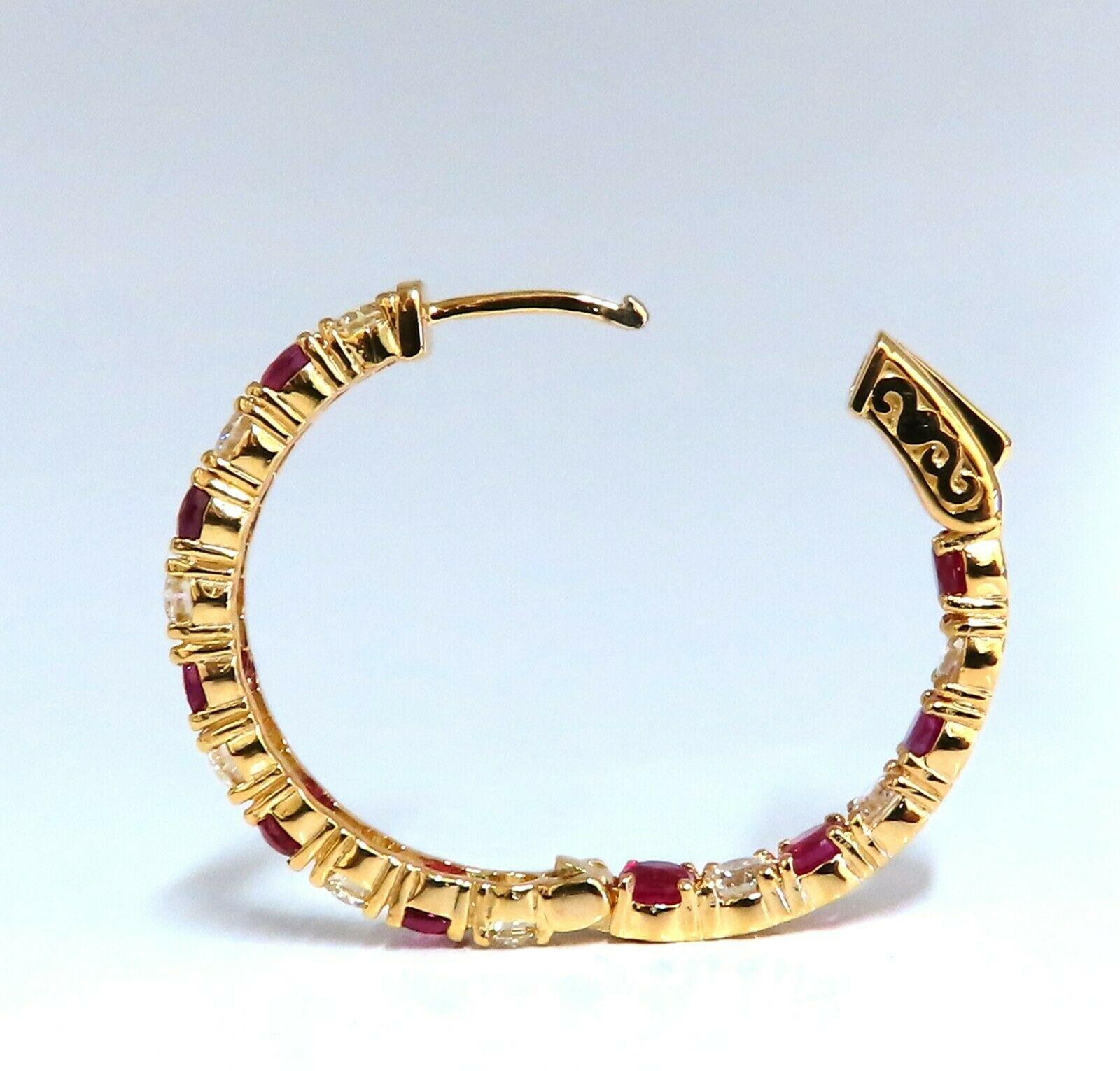 Inside/out  natural Ruby and Diamond hoop earrings.

4.53ct. round rubies, full brilliant cut clean clarity and transparent

2.66ct. natural round diamonds G color vs2 clarity.

14 karat yellow gold 10.4 g

30mm wide (front to back)

3.8 mm wide at