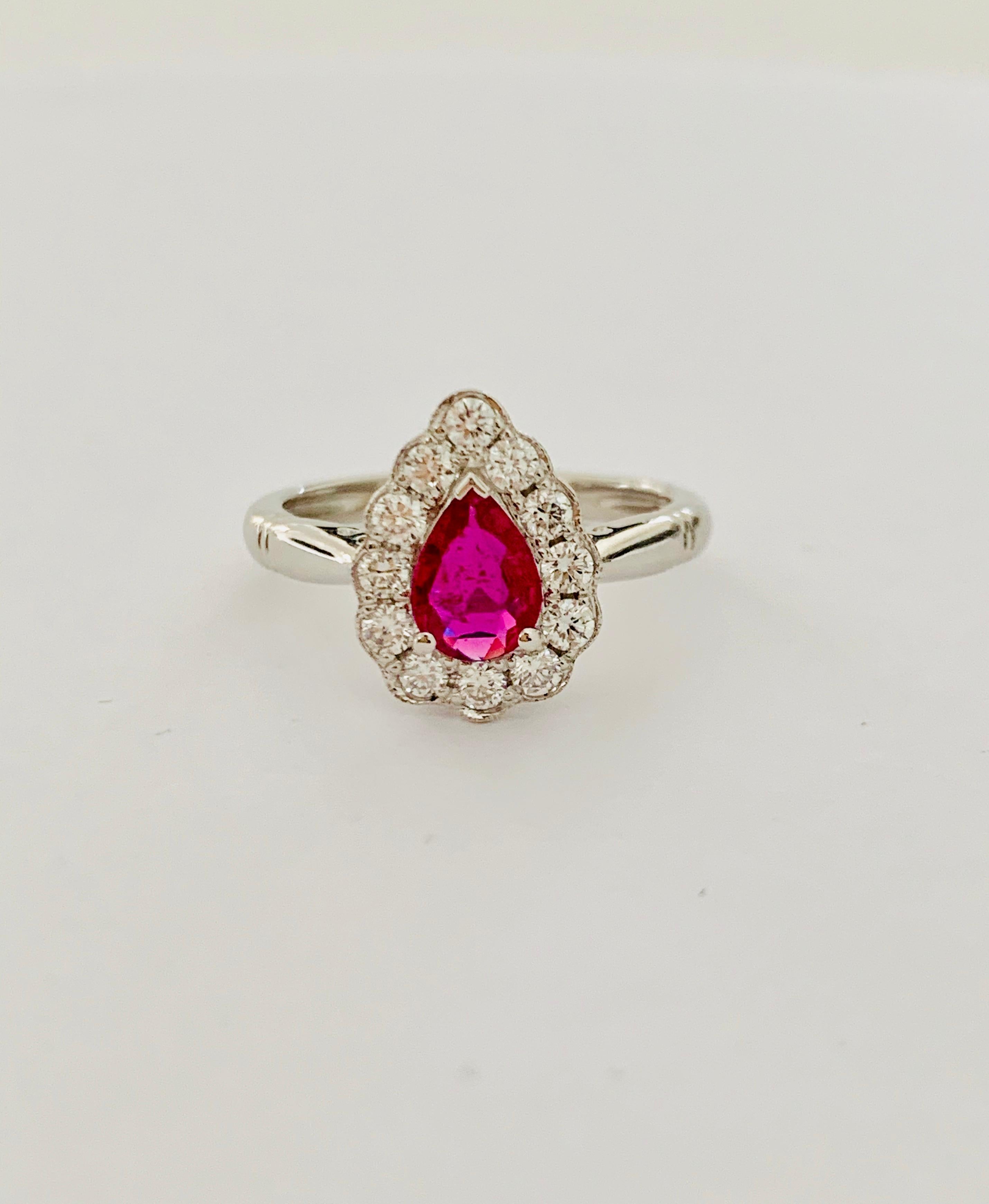 This exquisite 'ruby red' pear cut *Ruby is mounted in an 18 ct White Gold mount which is set with 12 Round Brilliant Cut Diamonds of G Colour and SI Clarity, weighing 0.36 ct in total.

This beautiful Ruby has wonderful clarity which can be seen in