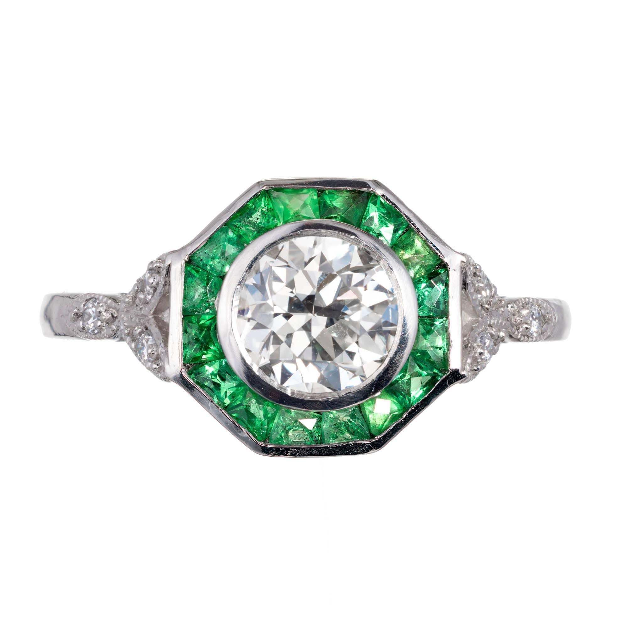 Platinum Diamond and emerald engagement ring with 8-sided top set with French style Calibré cut Emeralds and Diamond accents. EGL certificated.

1 round Diamond, approx. total weight .72cts, J – K, VS1, EGL certificate # US314492601D
6 round full