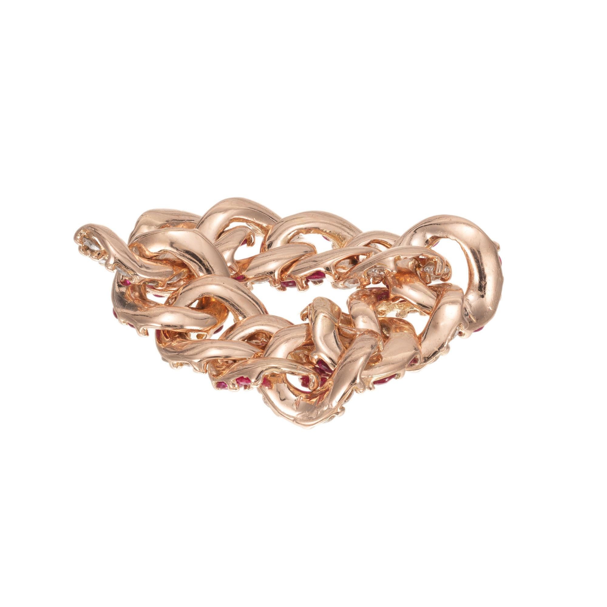 Vintage retro 1940's flexible link 18k rose gold ring with 24 round rubies and 24 round diamonds.  Handmade and not sizable.

24 round fine red rubies, VS-SI approx. .72cts
24 round brilliant cut diamonds, H VS approx. .60cts
Size 6.5 and not