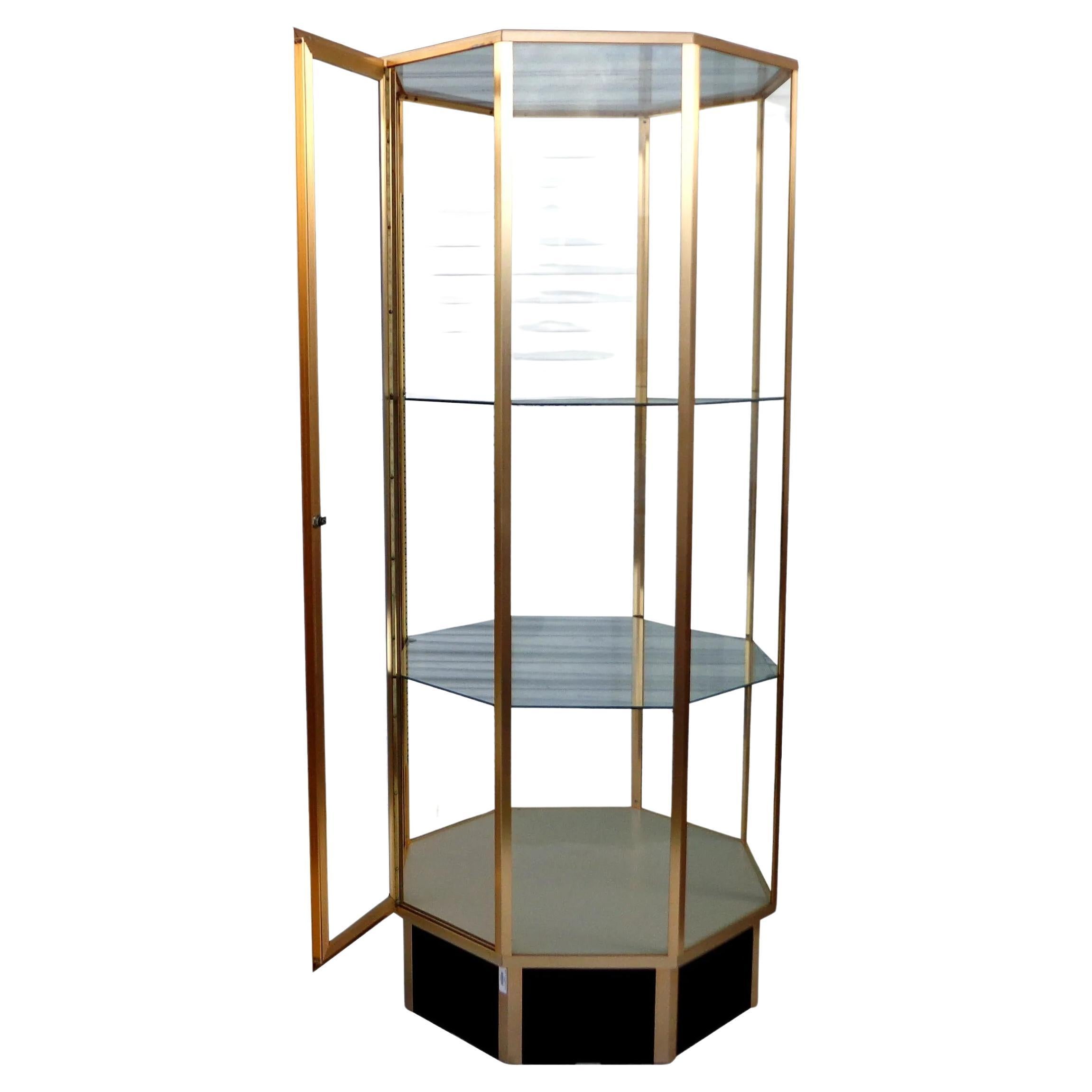 72? Hexagon Mastercraft style glass display cabinet

Black lacquered brass and glass display cabinet or vitrine. Three adjustable glass shelves.

2 available.
