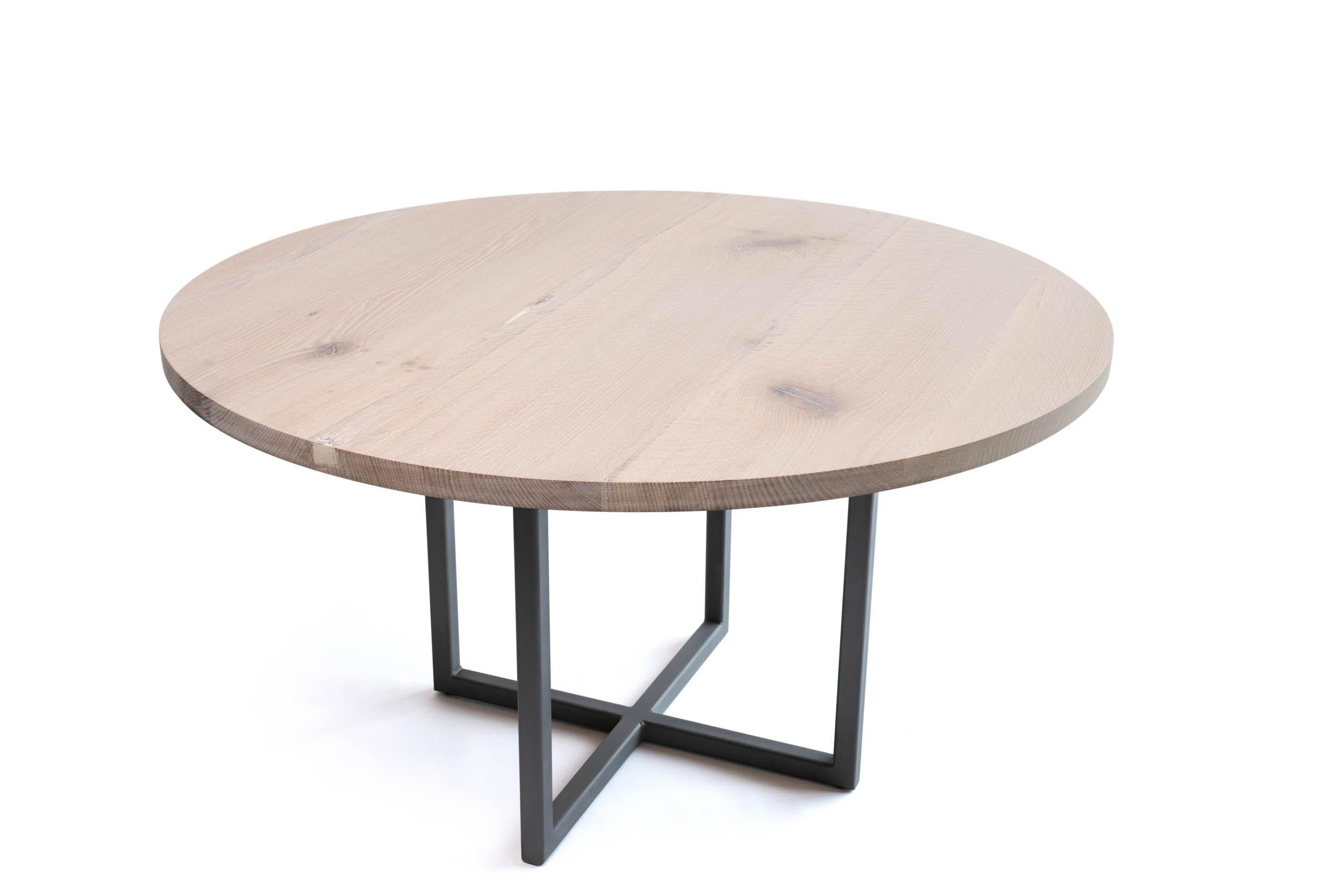 Round Dining Table in Light Wood and Pewter Modern Steel Pedestal Base is a variation of our sunrise base. Urban white oak with a white finish and unique pewter fills, emphasizes it casual and refined feel, begging you to touch and enjoy. The