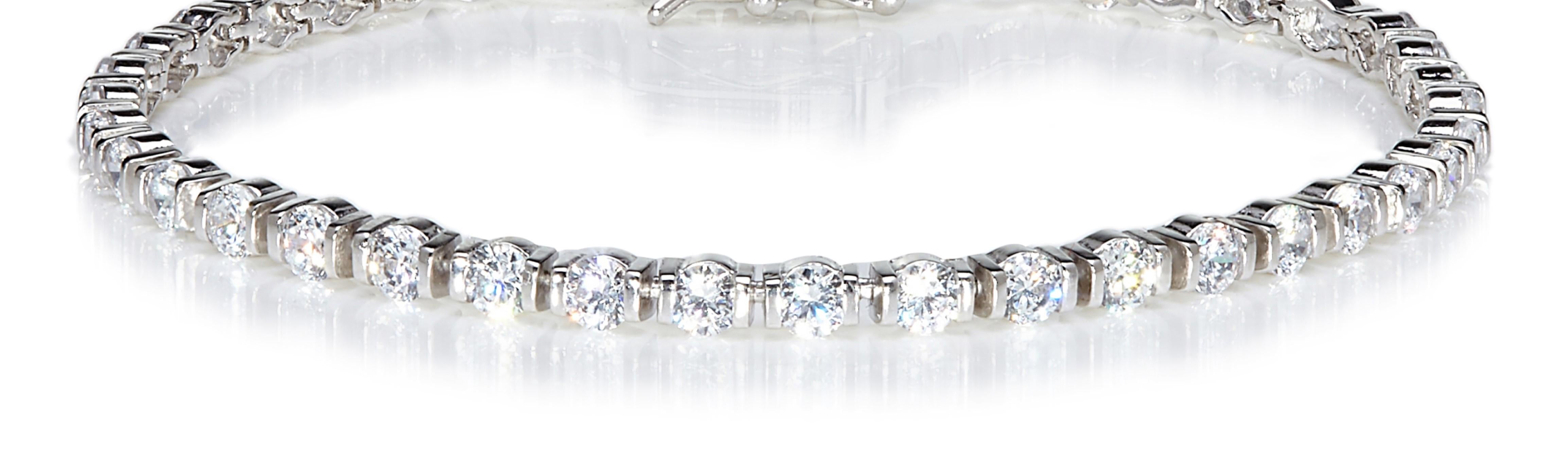 This intriguing line bracelet is set with 40 perfectly matched round brilliant cut cubic zirconia cleverly set to look like oval shaped stones..

Featuring 7.20ct cubic zirconia, set in 925 sterling silver with a high gloss white rhodium