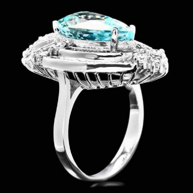 Anillo de oro blanco macizo de 14 quilates con 7,20 quilates de aguamarina natural y diamantes

El peso total de la aguamarina natural es Aprox. 5.50 Quilates

Medidas de la aguamarina 15.00 x 9.00mm

Diamantes Redondos Naturales Peso: Aprox. 1,70