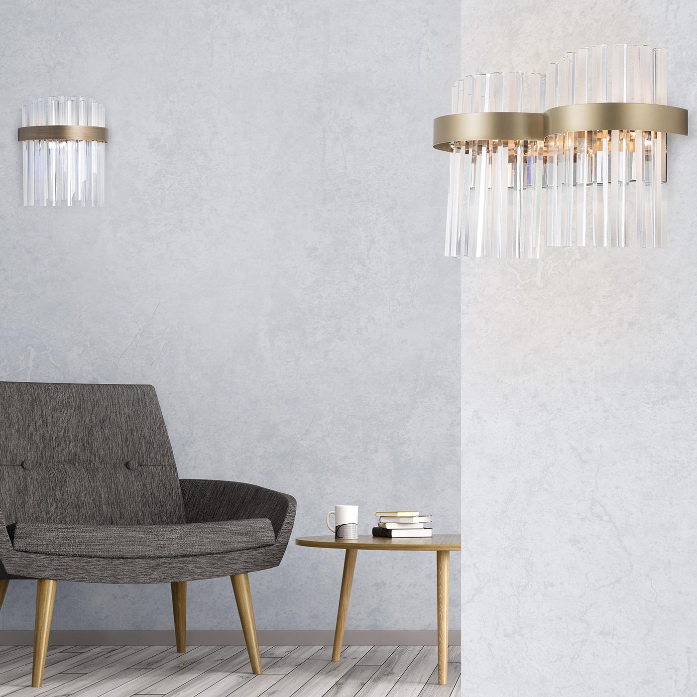 A simple, luxurious wall lamp characterized by its minimalistic and essential design. It is made in T5 lead crystal and it uses 2 G9 energy saver or 2 G9 LED lamps. It is available in the brushed gray, dove-gray or brushed burnished finishes.