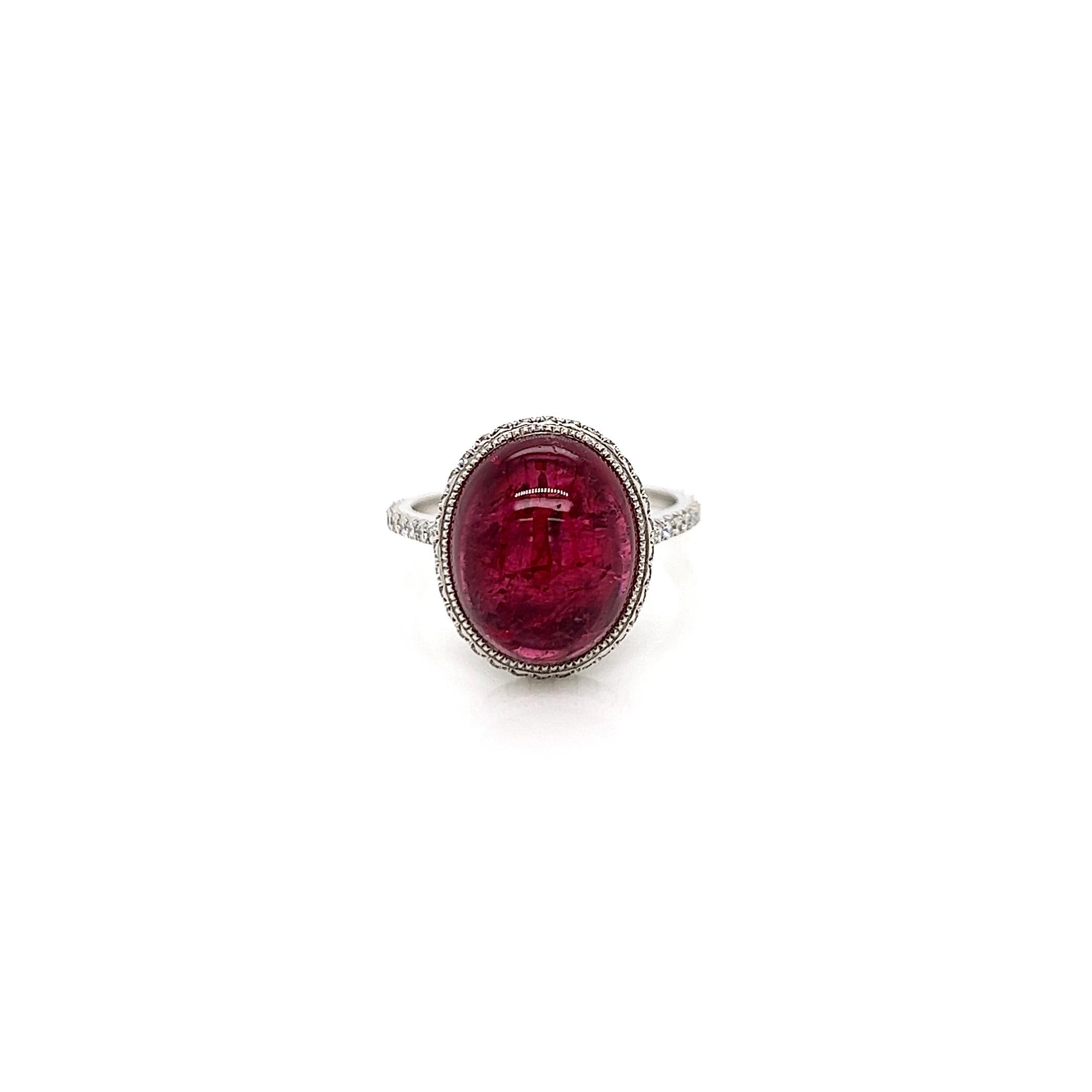 7.70 Total Carat Pink Tourmaline and Diamond Cocktail Ring

-Metal Type: Platinum 
-7.20 Carat Oval Cut Pink Tourmaline 
-0.50 Carat Round Side Natural Diamonds, F-G Color, VS1-VS2 Clarity
-Size 6.25

Made in New York City