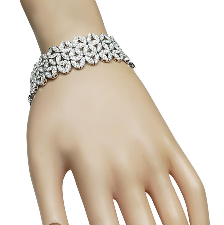 This is an elegant 18k white gold bracelet. The bracelet is set with sparkling round cut diamonds that weigh approximately 7.20ct. The color of these diamonds is G-H with VS clarity. The bracelet measures 21mm in width and 7 1/4 inches in length.