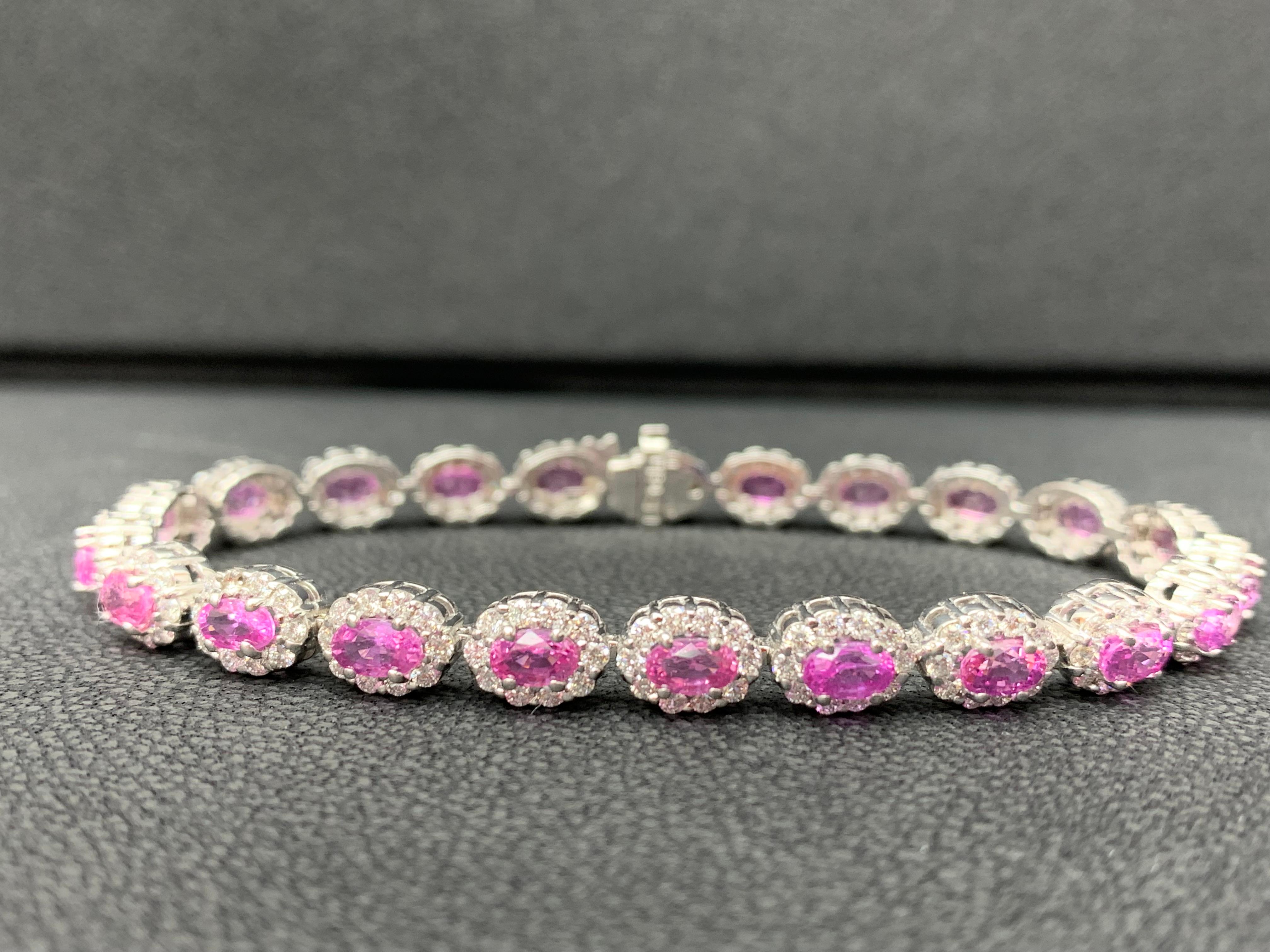 A beautiful pink sapphire and diamond bracelet showcasing color-rich pink sapphires, surrounded by a single row of brilliant round diamonds. 20 Oval cut pink sapphires weigh 7.21 carats total; accent diamonds weigh 3.30 carats total.

Style