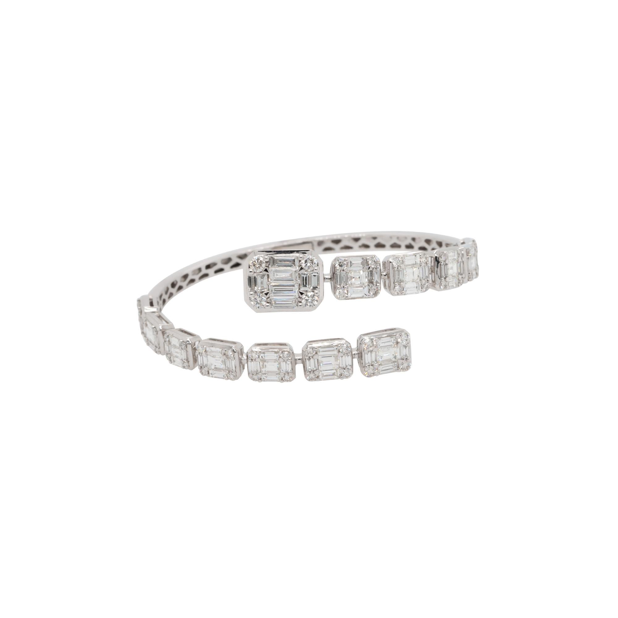 Material: 18k White Gold

Diamond Details: 
5.72ctw of baguette cut natural Diamonds. Diamonds are G/H in color and VS in clarity
1.49ctw of round cut natural Diamonds. Diamonds are G/H in color and VS in clarity

Measurements: 64mm x 25mm x