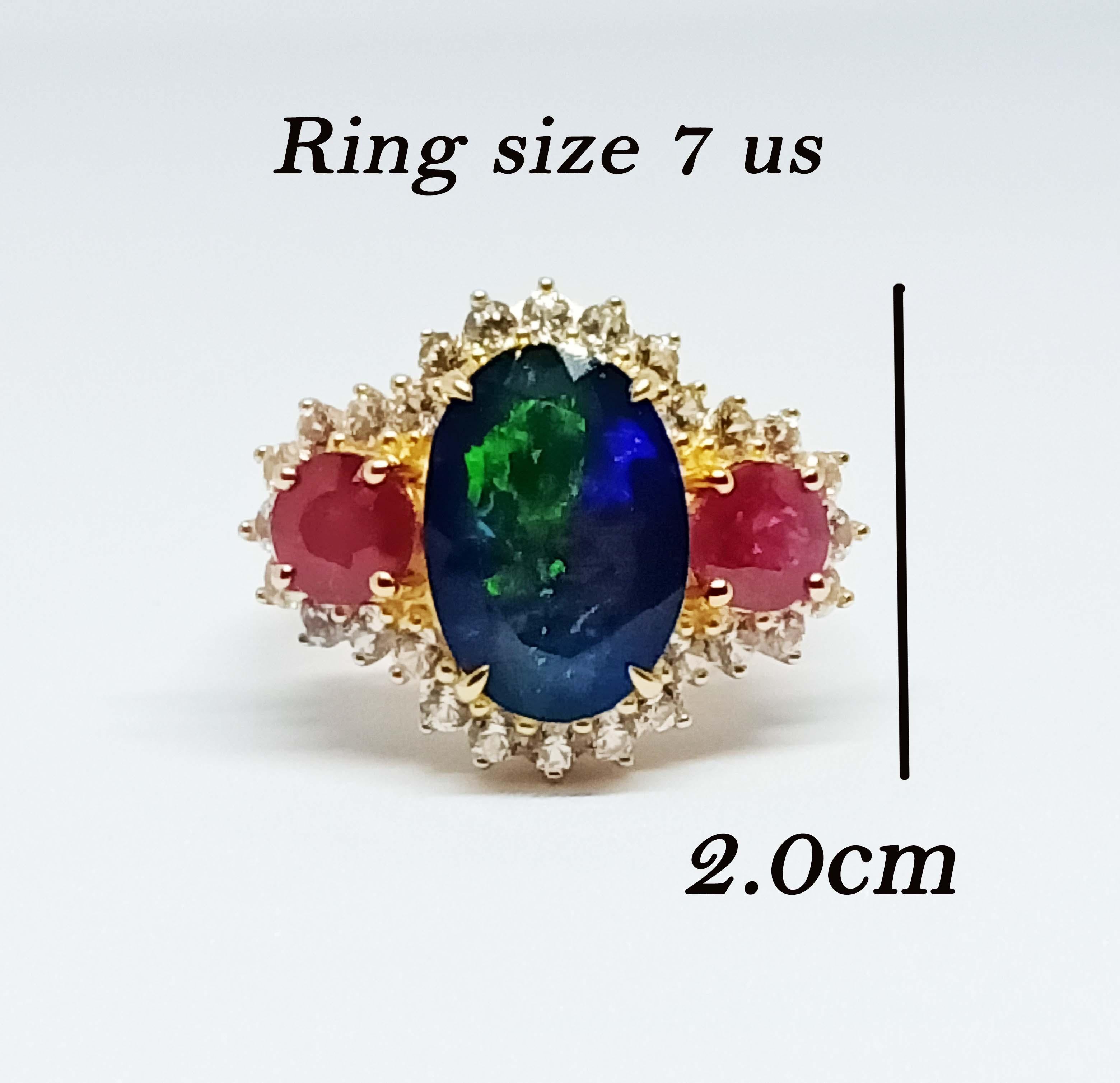 Black Opal   Oval  5.2x10.5mm.  7.09 cts.
Ruby             Round 6 mm.  2.52cts.  2 pcs. 
White Zircon Round 2.25 mm. 28 pcs.

Sterling Silver on 18K Gold Plated.
Ring : Size 7 us.


