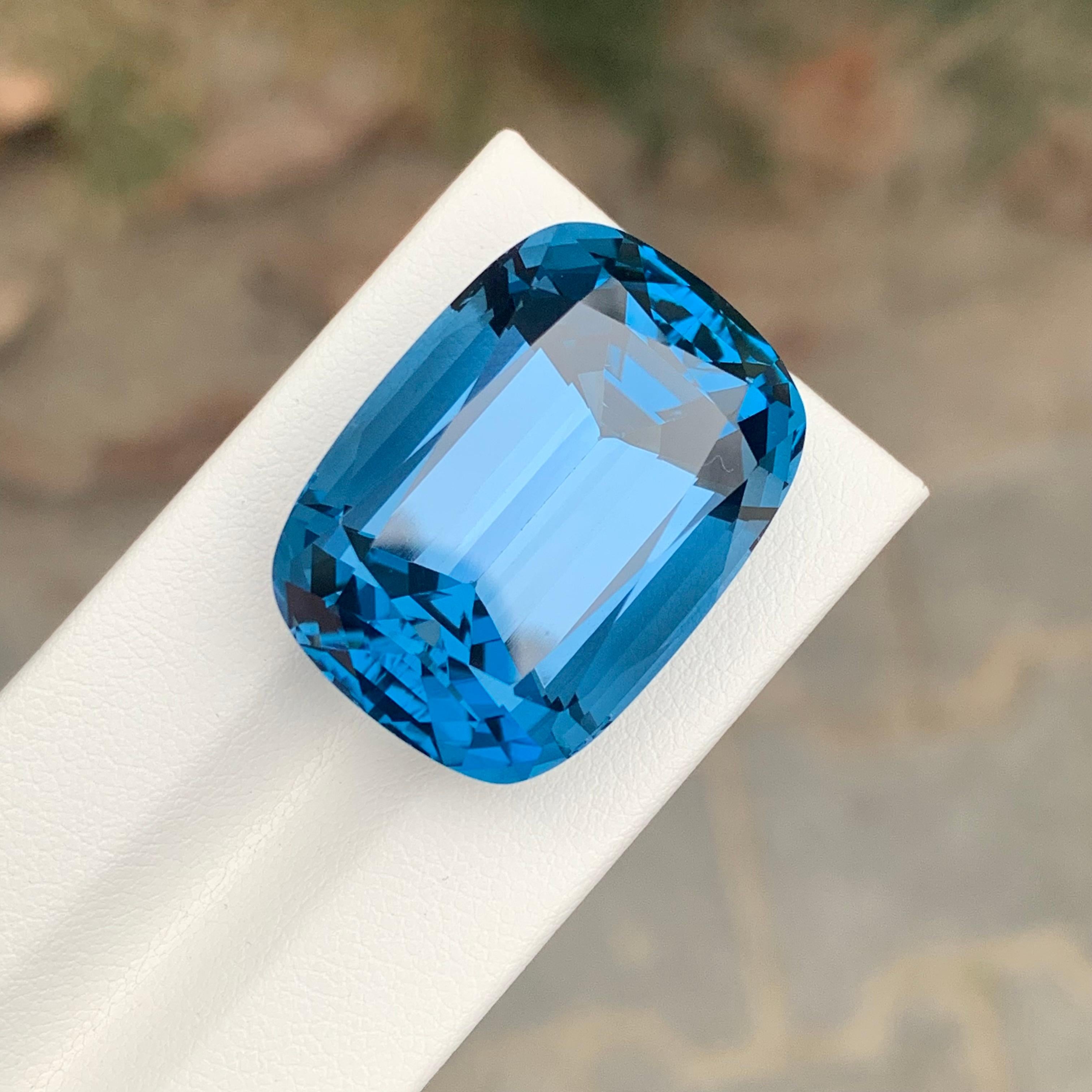 Loose London Blue Topaz

Weight: 72.10 Carats
Dimension: 26 x 19 x 15.6 Mm
Origin: Brazil
Shape: Cushion
Color: Deep Blue
Certificate: On Customer Demand

London Blue Topaz is a mesmerizing variety of topaz renowned for its deep and enchanting blue