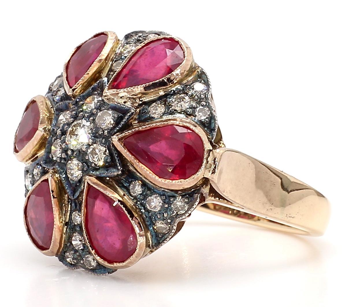 Introducing our magnificent Antique Ruby Ring, a true testament to timeless beauty and vintage elegance. This exceptional piece features a stunning 7.22-carat ruby, complemented by 1.00 carat of diamonds, all set in a luxurious 18K gold band