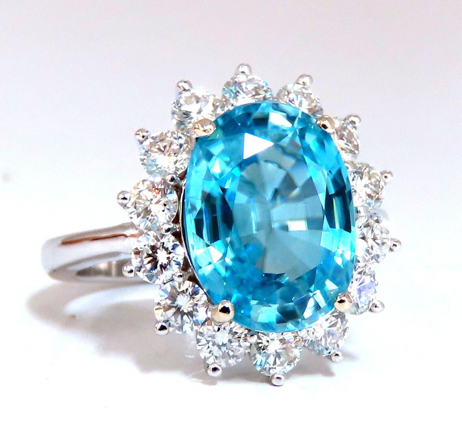 Indigo Blue Natural Zircon ring.

7.22ct. Natural Blue Zircon Oval cut

13 X 9.8mm

VS Clean Clarity, Transparent

1.80ct Side Full cut natural round diamonds G-colors & Vs-2 clarity

18kt. White gold

9.4 grams

Ring Current size: 7.5

depth of