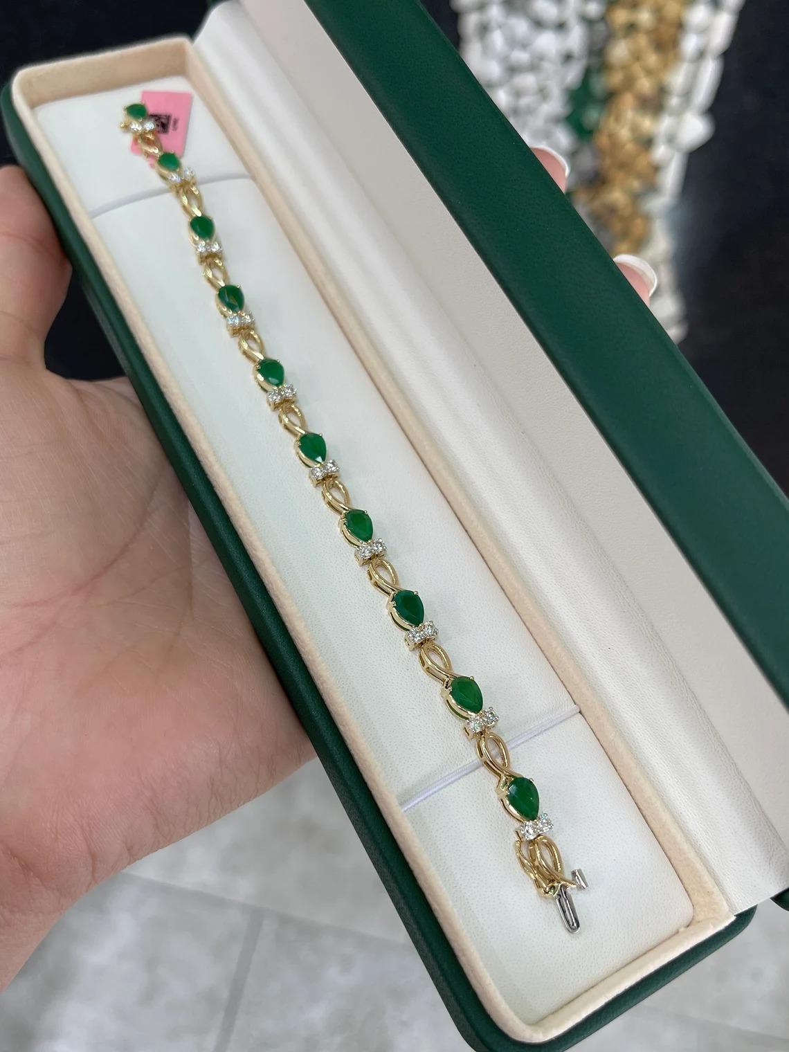 A stunning emerald and diamond accent bracelet. This exceptional piece features almost six carats of lush alpine dark green emeralds cut into the shape of a pear and showcases good luster as well as clarity. Two sparkly white brilliant round cut