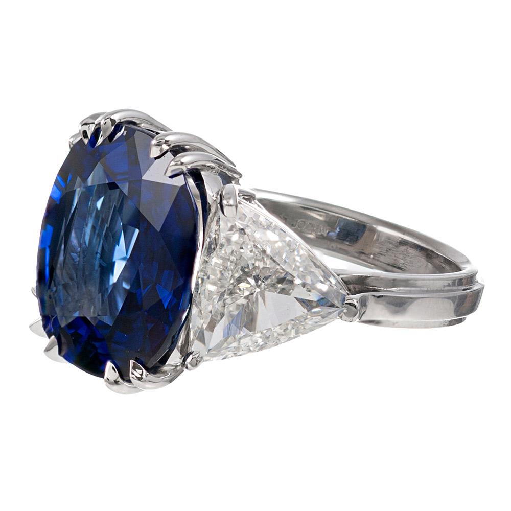 A classically styled, important and sophisticated piece, the design is centered upon a gem fine oval sapphire of 7.23 carats. The stone exhibits beautiful and intense medium blue color that will delight the gemstone enthusiast. Contained in four