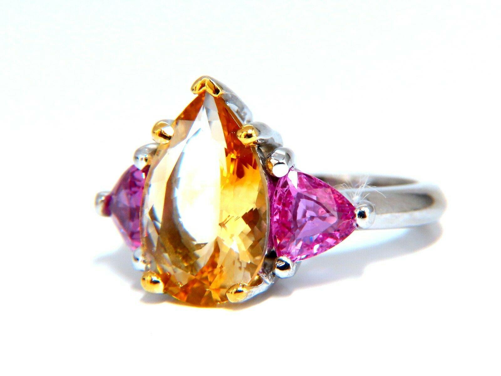 5.11ct. Natural Golden Citrine  ring.

Pear cut, Excellent VS Clean Clarity

Brilliant Vivid Bright Yellow golden color

14.5mm X 10mm

2.12ct Natural Trilliant Pink Sapphires

5.5 x 6mm each

Platinum

14 grams.

Depth of ring: 8.5mm

current ring