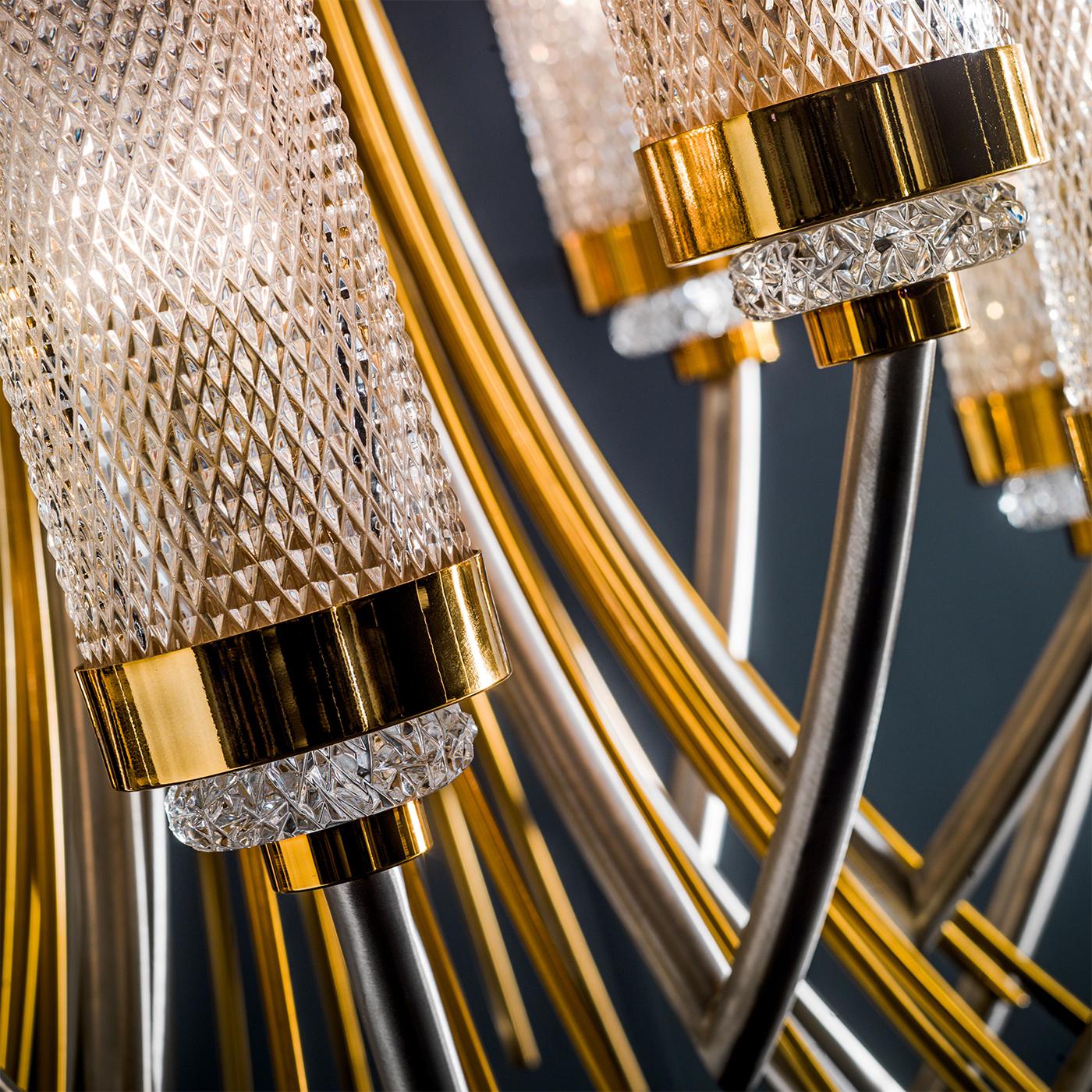 Add elegance, opulence and superior illumination to practically any space with this modern and stylish chandelier. The brass structure is in flash gold and satin nickel finish, while the multiple heads are in hand faceted crystal, providing warm