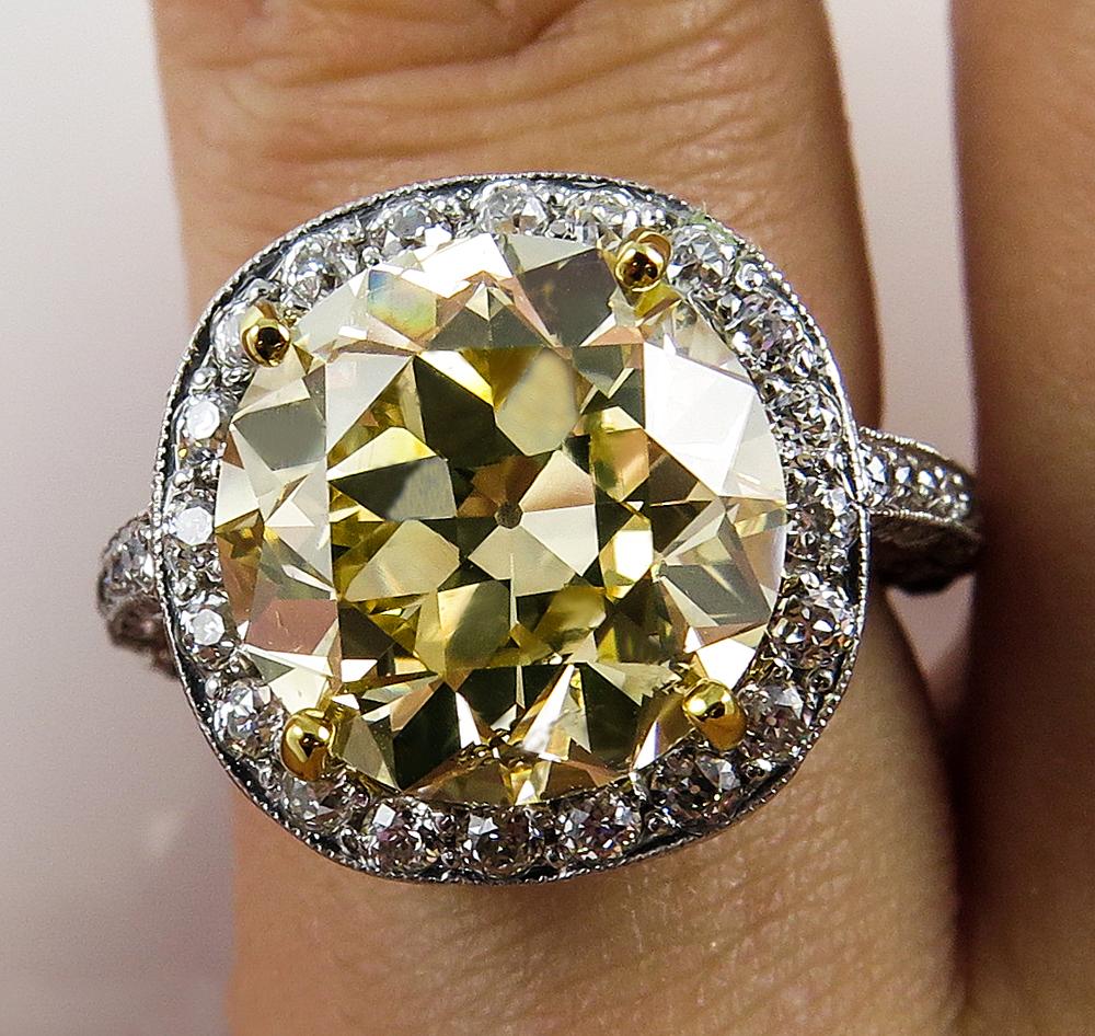 Gorgeous and Rare Estate Vintage Diamond Ring with 5.73ct Transition Round Brilliant Center Diamond EGL USA Certified FANCY LIGHT YELLOW Color, SI2 clarity. Beautiful Color, Even color distribution, super Brilliant! It is really a Transitional cut,