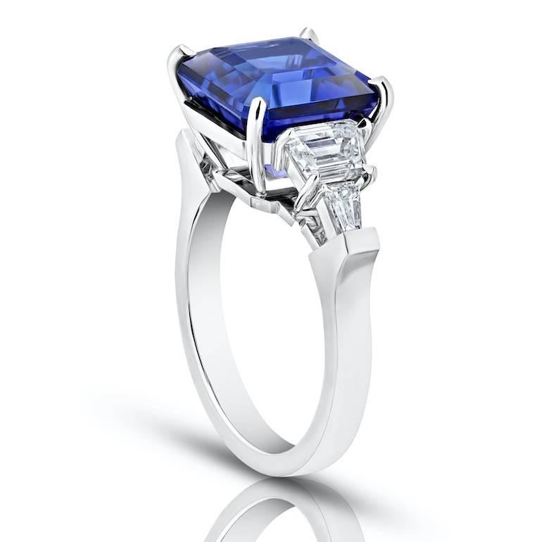 7.25 carat Blue Asscher Cut Tanzanite set with trapezoid cut and tapered emerald cut diamonds weighing 1.27 carats set in Platinum hand crafted ring
