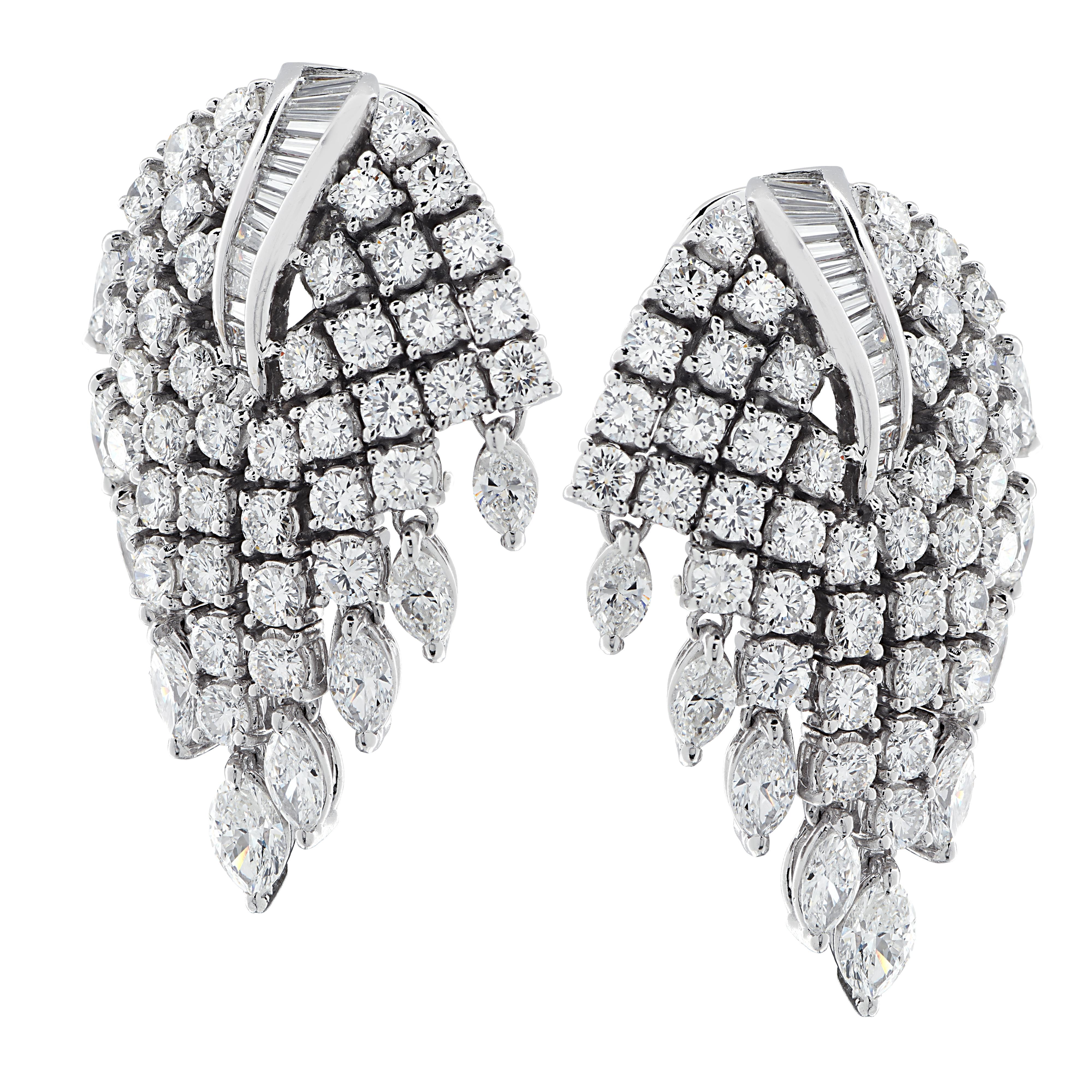 Glamorous clip on earrings crafted in platinum featuring 132 round brilliant cut, marquise and baguette diamonds weighing 7.25 carats total, F color VS clarity. Rows of round brilliant cut diamonds with a marquise drop cascade from a baguette