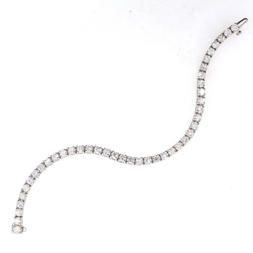 This premium tennis bracelet features 46 round brilliant cut diamonds set in 14 karat white gold. The diamonds are all graded H-I color and SI1-2 clarity and all together the diamonds weigh approximately 7.25 carat total weight. The bracelet