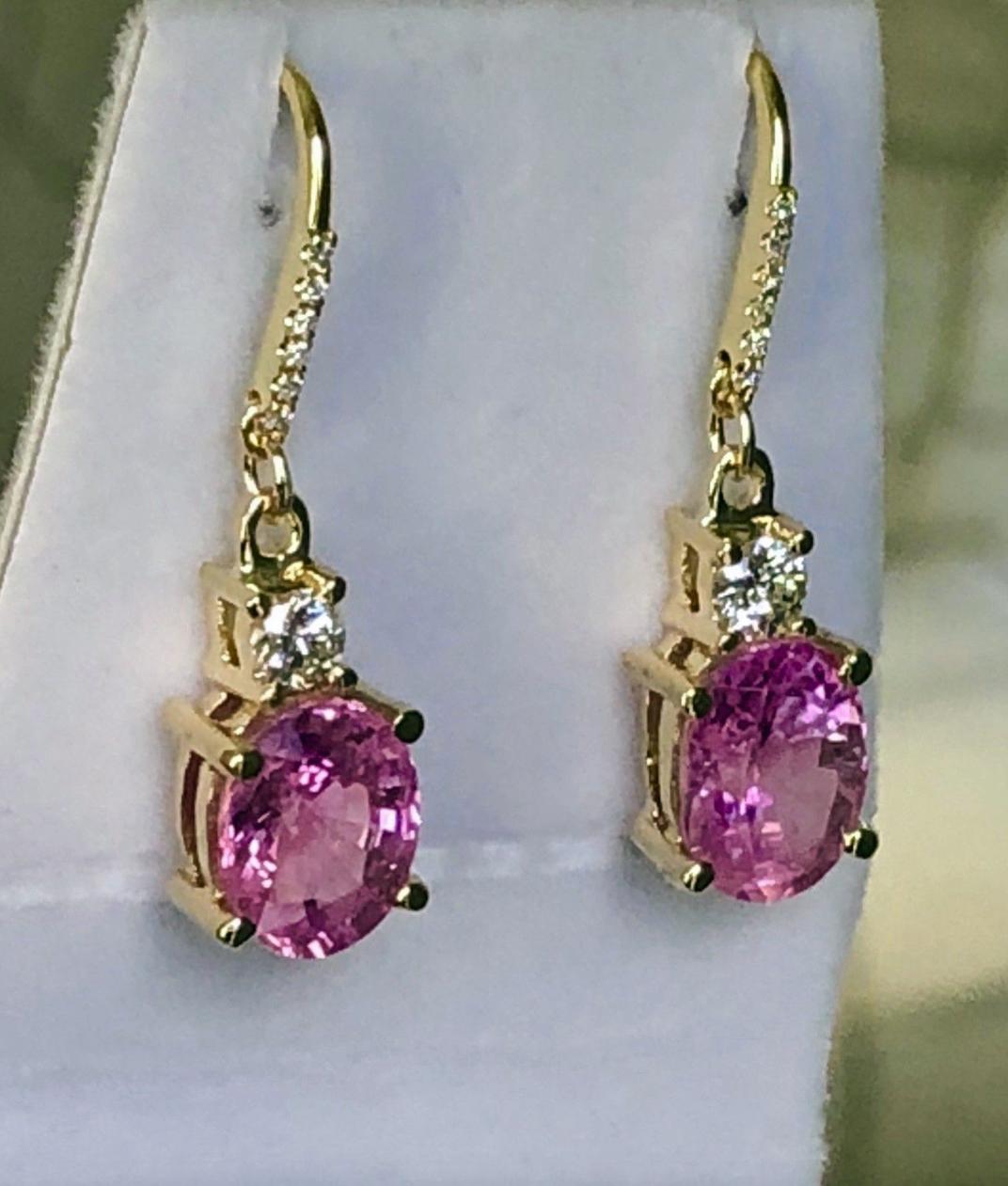 A brilliant pair of 18K yellow gold Natural Burmese Pink Sapphires and Diamond Drop Dangle Earrings.
The Earrings Featuring Two Pink Sapphire Weight Is 6.75 Carats (Sapphires Are Vivid Pink And Just Stunning!! Each Sapphire Is Approx. 3.38 Carats