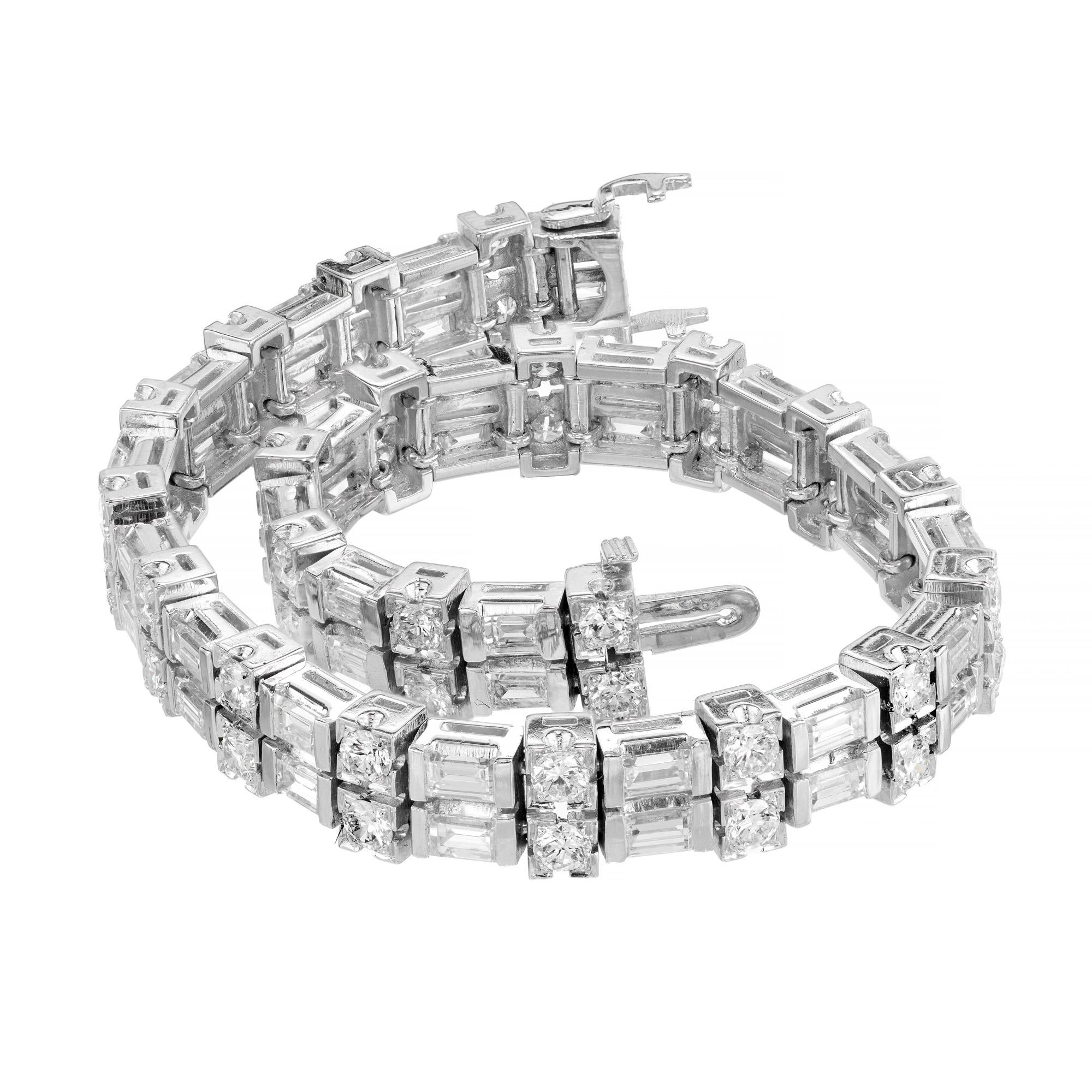 An exquisite 7.25 carat round & baguette diamond platinum bracelet measuring a length of 7 inches. 1950’s. This heavy sturdy bracelet features an alternating design of two rounds and two baguettes with high quality white diamonds. Each diamond