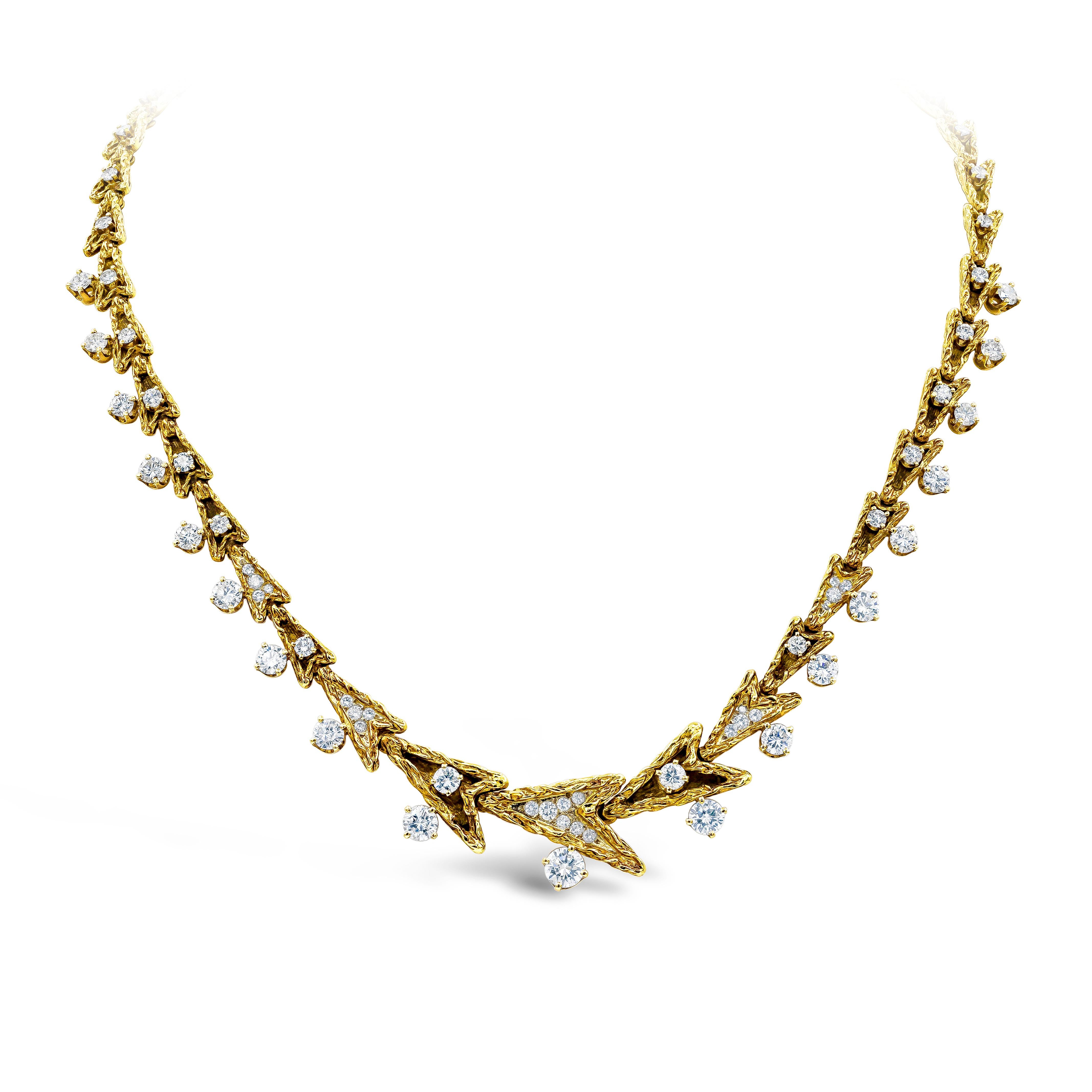 A antique and intricately-designed necklace showcasing a line of arrowhead shapes accented by round brilliant diamonds weighing 7.25 carats total. Diamonds are approximately G color and VS in clarity. Finished with hand-engraved etches. Finely made