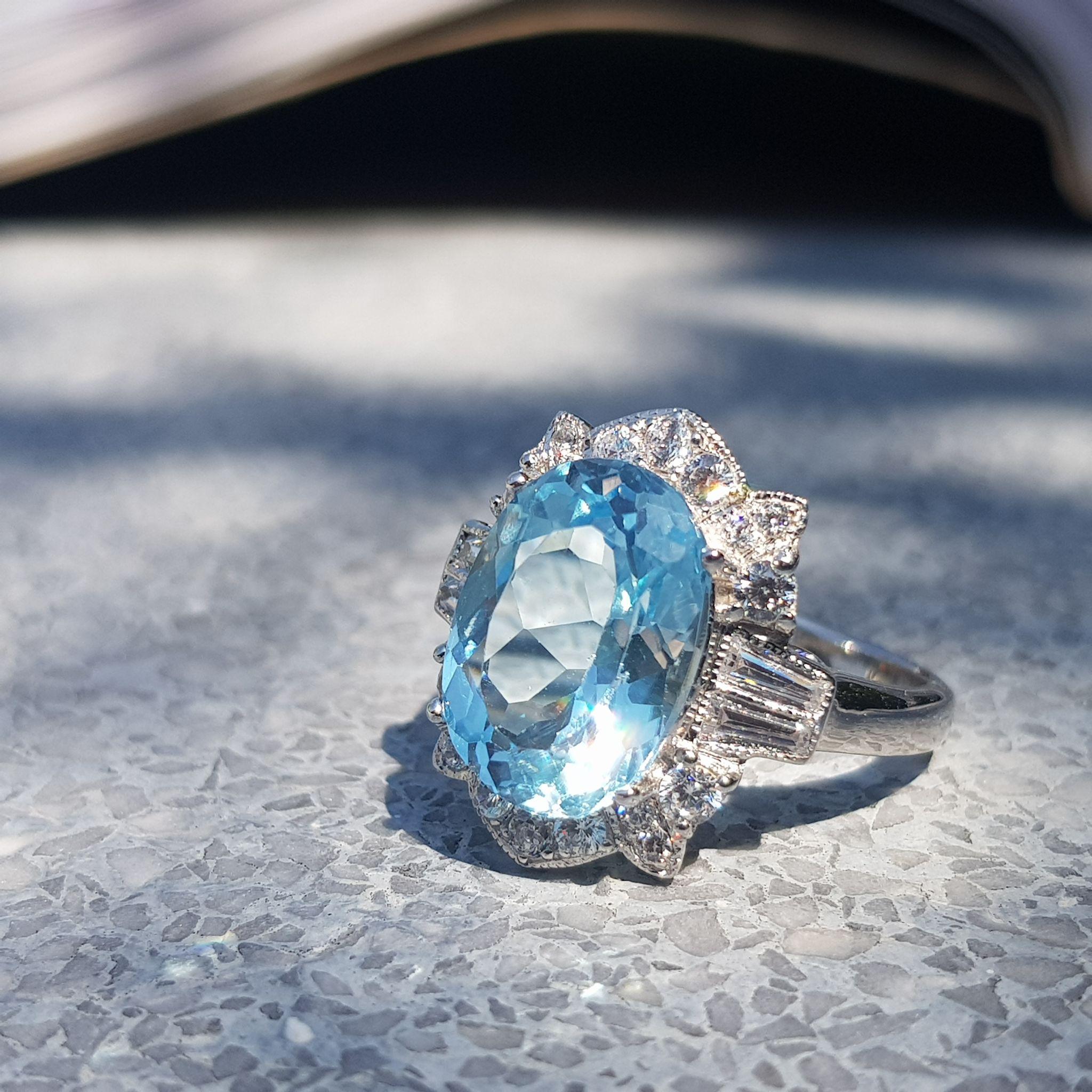For Sale:  7.25 Ct. Oval Blue Topaz and Diamond Cocktail Ring in 18K White Gold 8