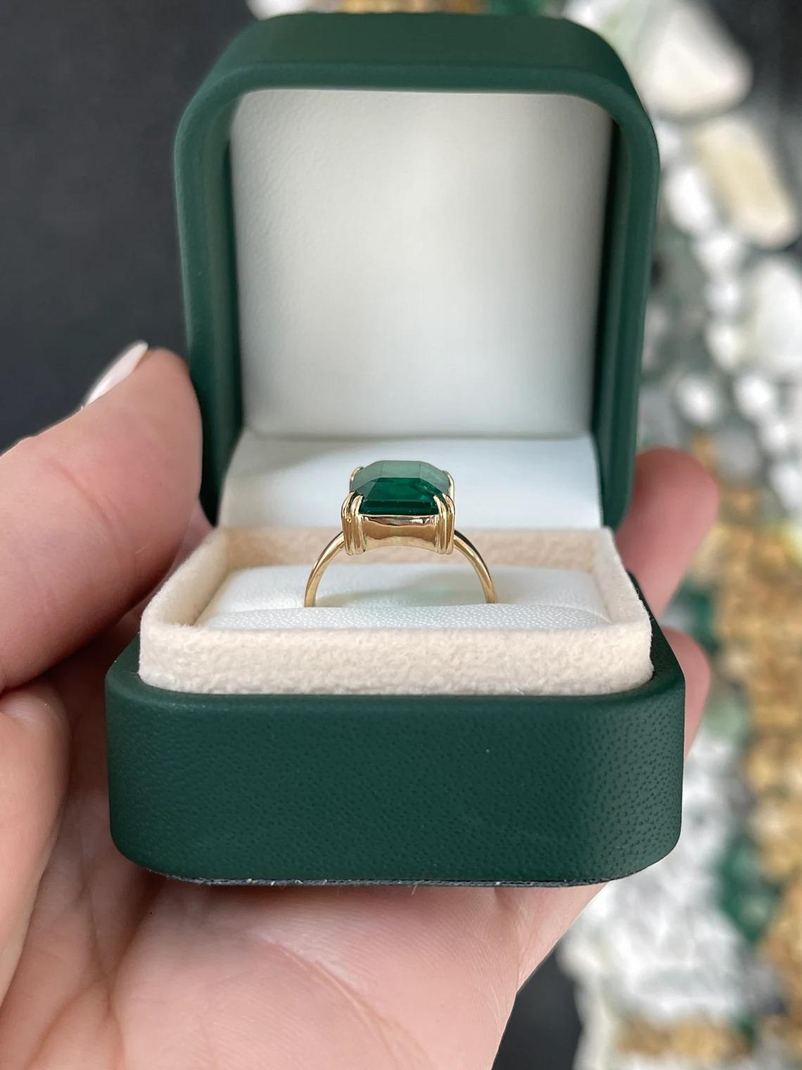 7.25ct 18K Deep Green Large Emerald Cut Emerald Double Claw Prong Solitaire Ring In New Condition For Sale In Jupiter, FL