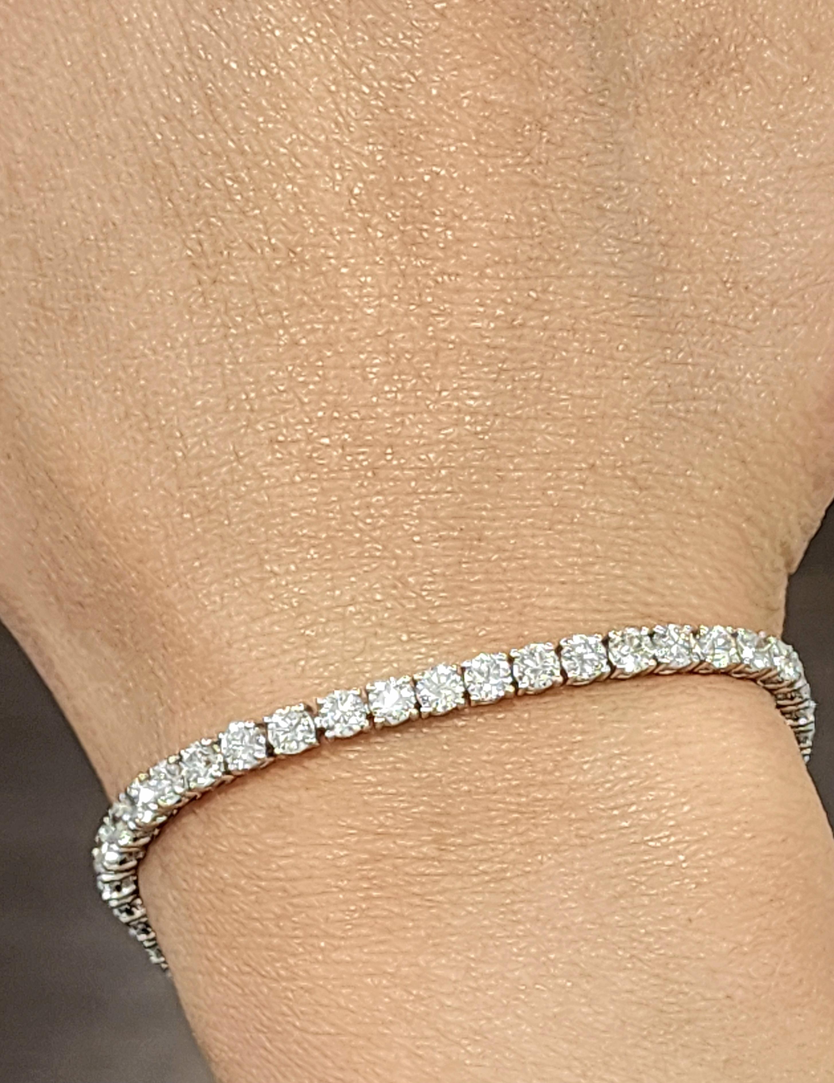This exquisite tennis bracelet is a true masterpiece. Featuring 51 round-cut diamonds with a total carat weight of 7.26, the stones exhibit a stunning white F/G color and VS2/SI1 clarity. Crafted from platinum, the bracelet measures 7 inches in