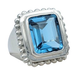 7.27 Carat Emerald Cut Blue Topaz Scalloped Edge Cocktail Ring in 14 Karat Gold