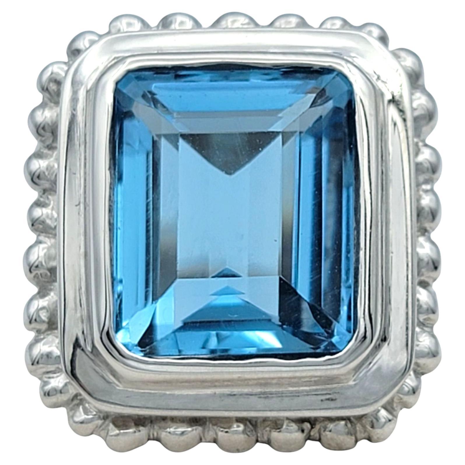 7.27 Carat Emerald Cut Blue Topaz Scalloped Edge Cocktail Ring in 14 Karat Gold